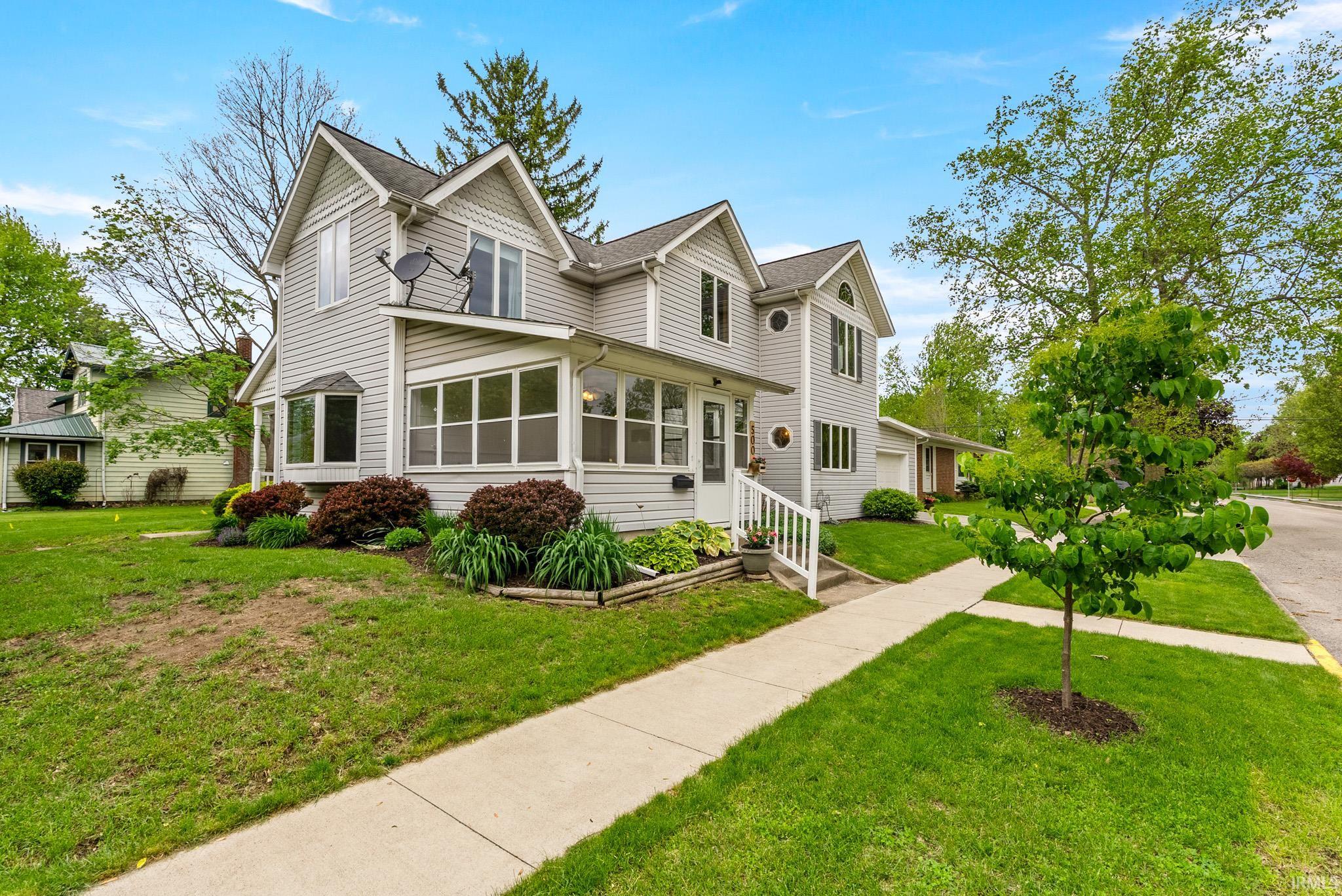 Gray siding exterior with multiple gables