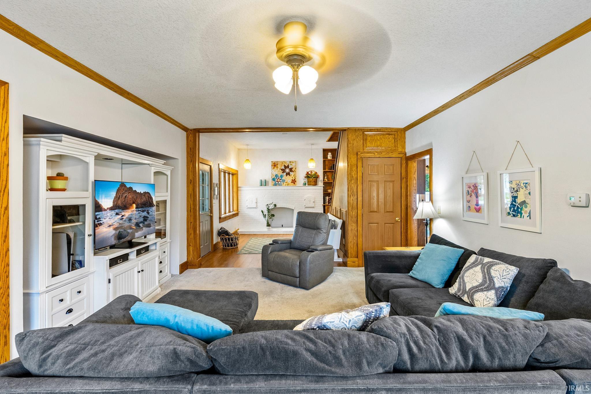 Living area with white walls and natural wood trim accents