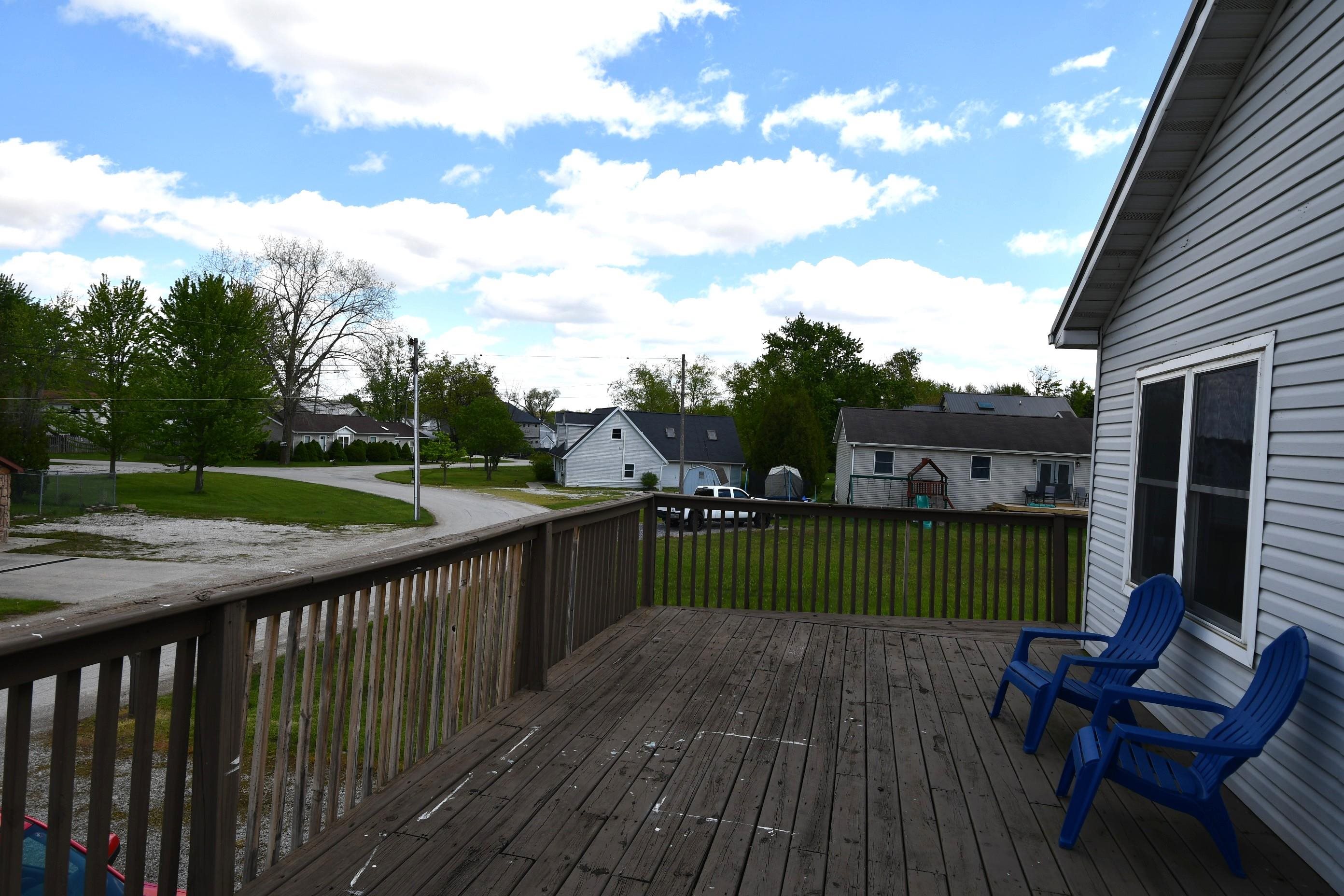 Spacious exterior wood deck with full railing