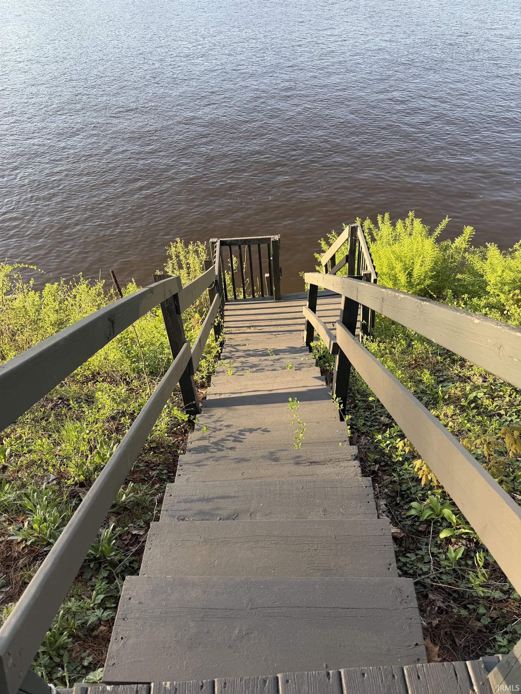 Terraced wooden stairway providing direct access to the water