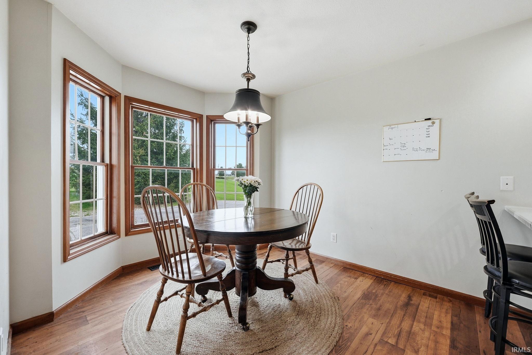 Bay window with wood-finish trim and grid-patterned panes