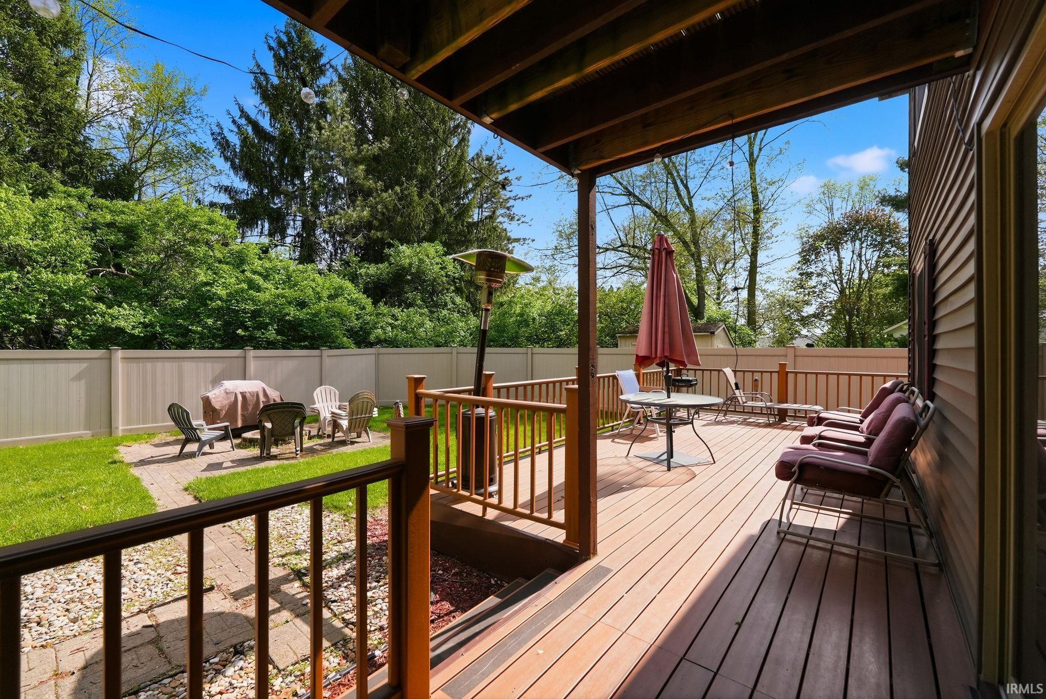 Expansive multi-level wood deck with wood railings