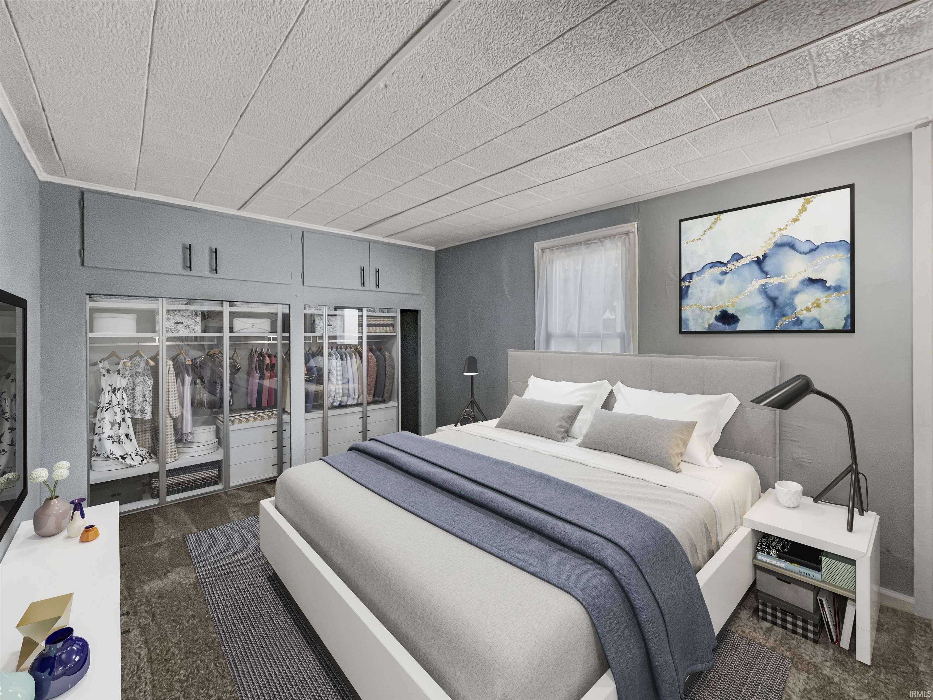 Integrated full-wall closet system with clear panel doors and upper storage cabinetry