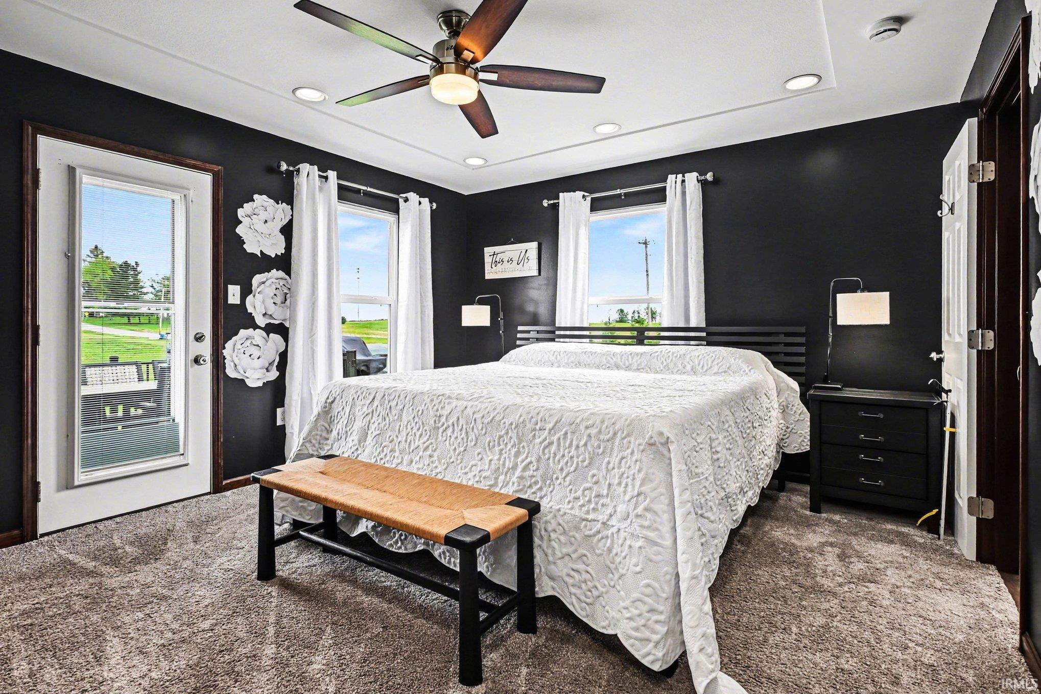 Tray ceiling with recessed lighting and a ceiling fan