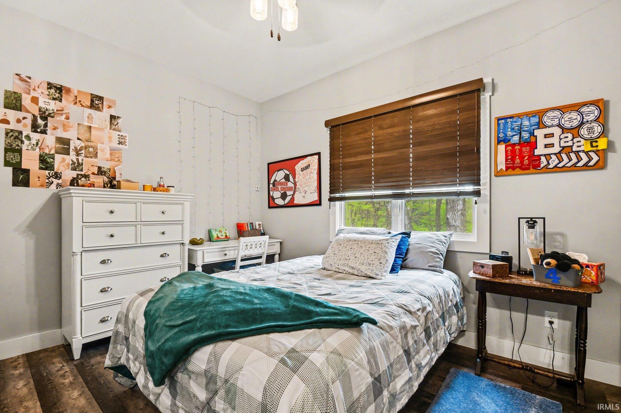 Inviting room with wood-finish flooring and light gray walls