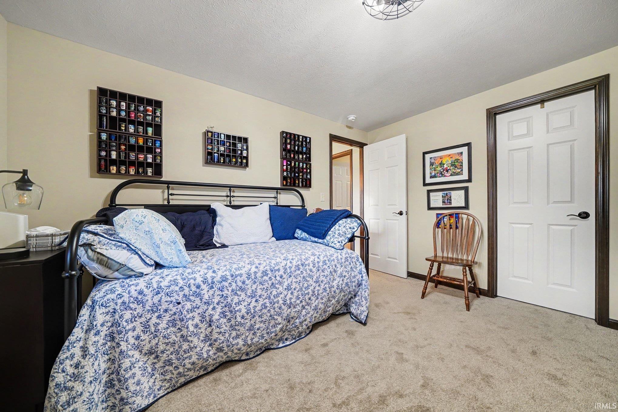 Neutral-toned walls complement plush carpeting