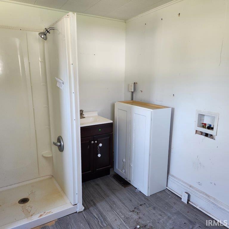 White shower stall with a brushed chrome showerhead