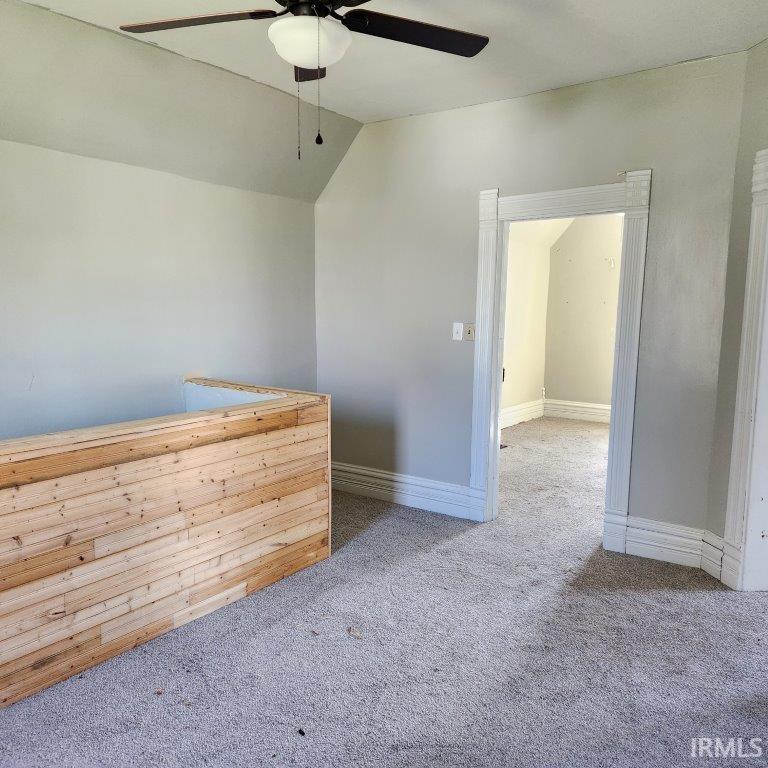Neutral-toned walls complement light gray carpeting
