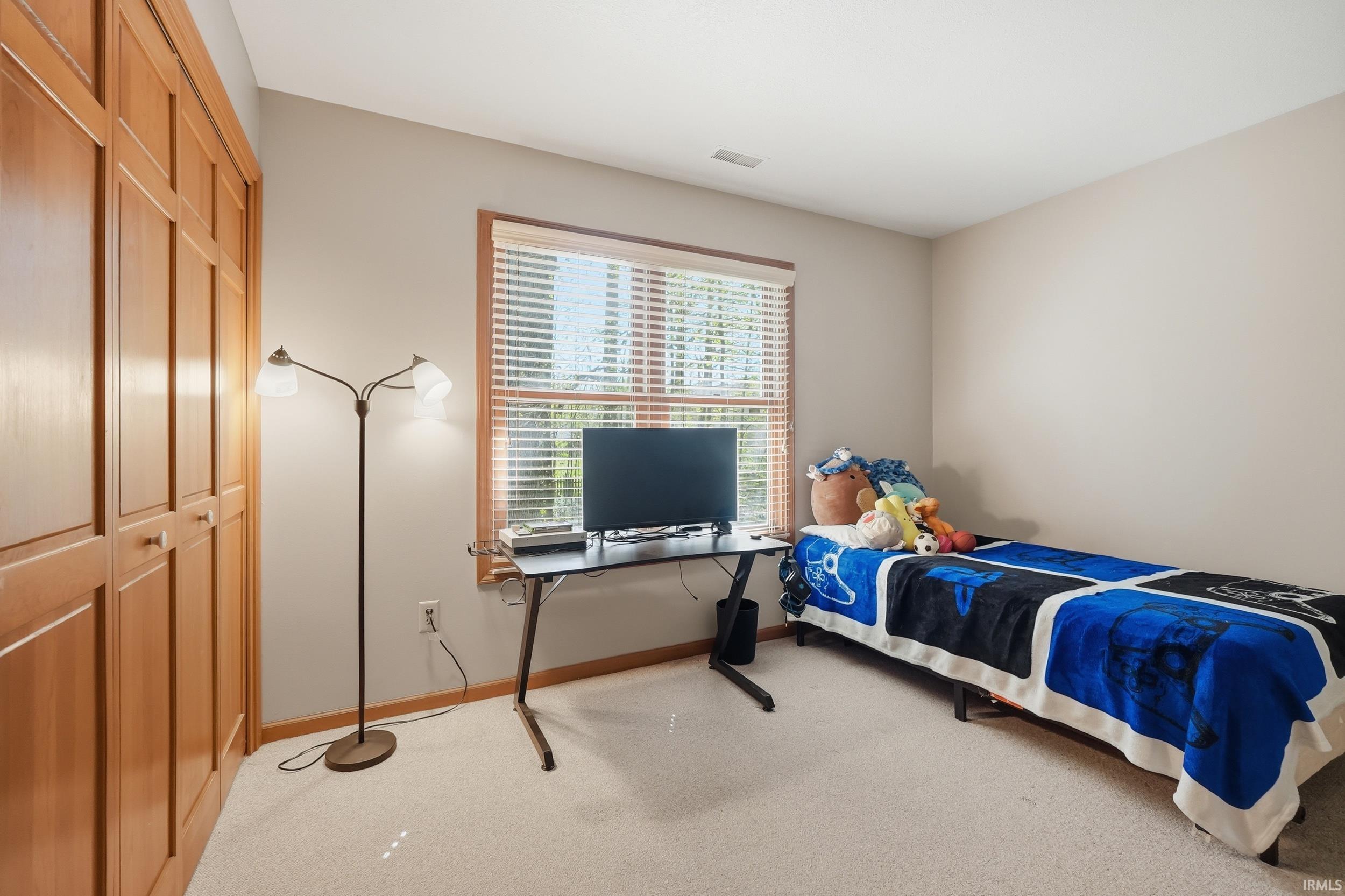 Neutral toned walls complement light-colored carpeting