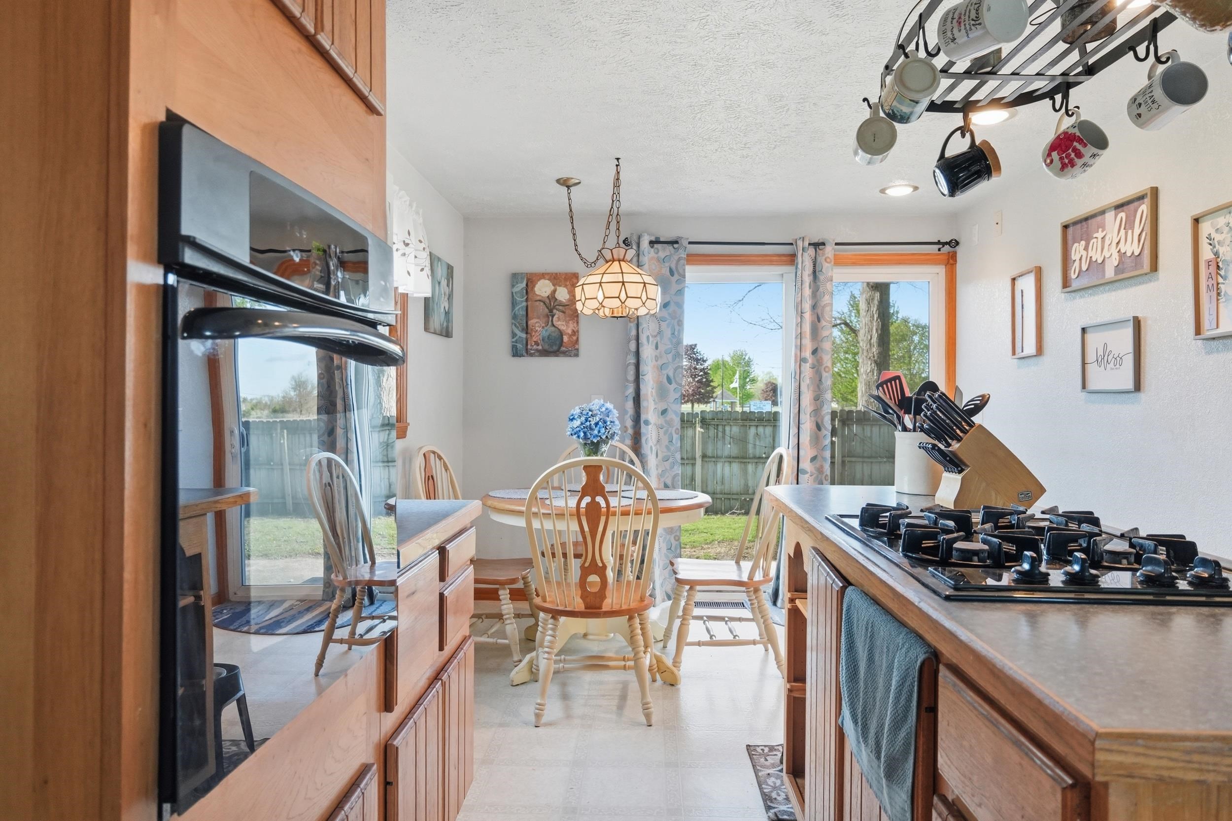 Kitchen featuring a built-in wall oven and a countertop gas range