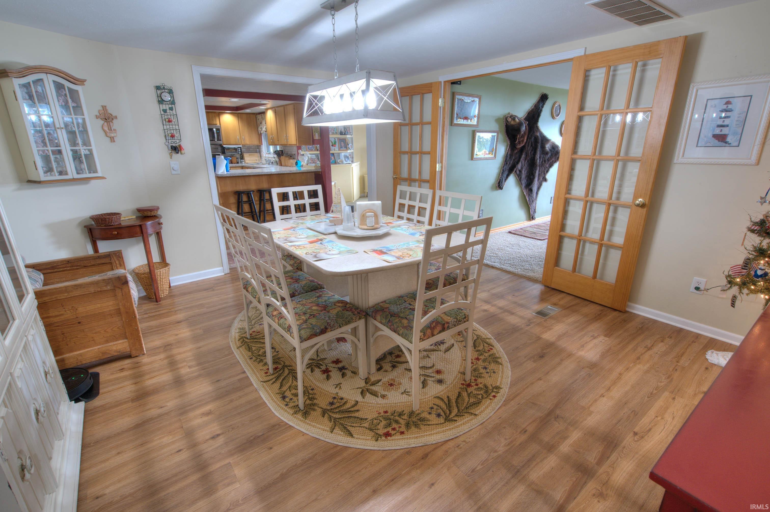 Wood-finish flooring throughout the dining area