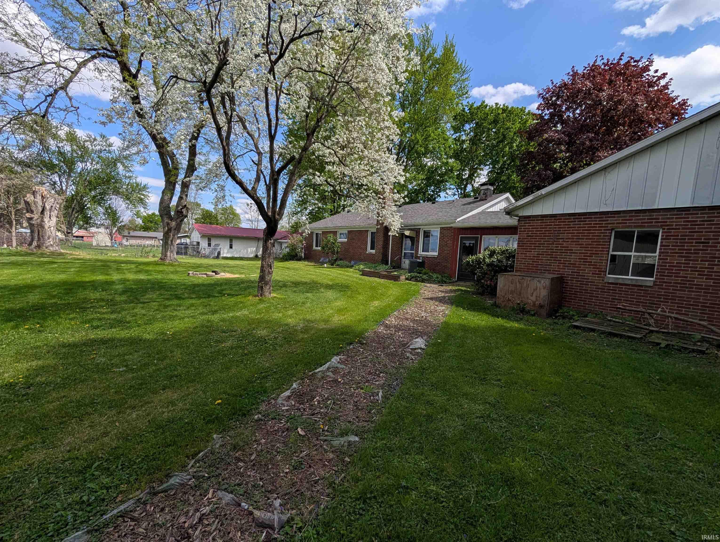 Expansive lawn with mature blooming trees