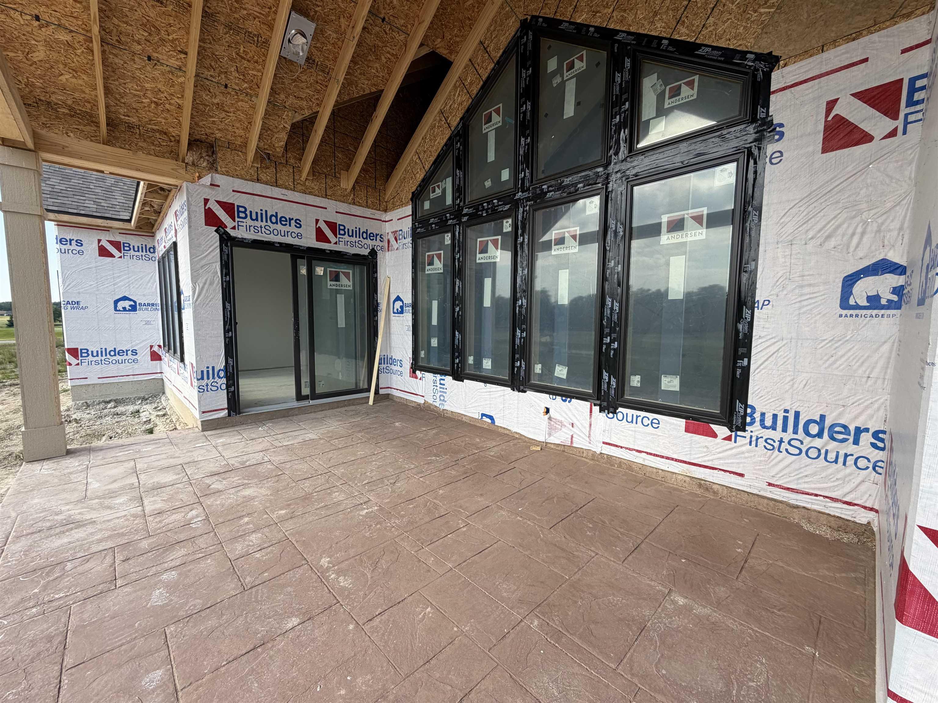Expansive outdoor patio featuring stamped concrete flooring