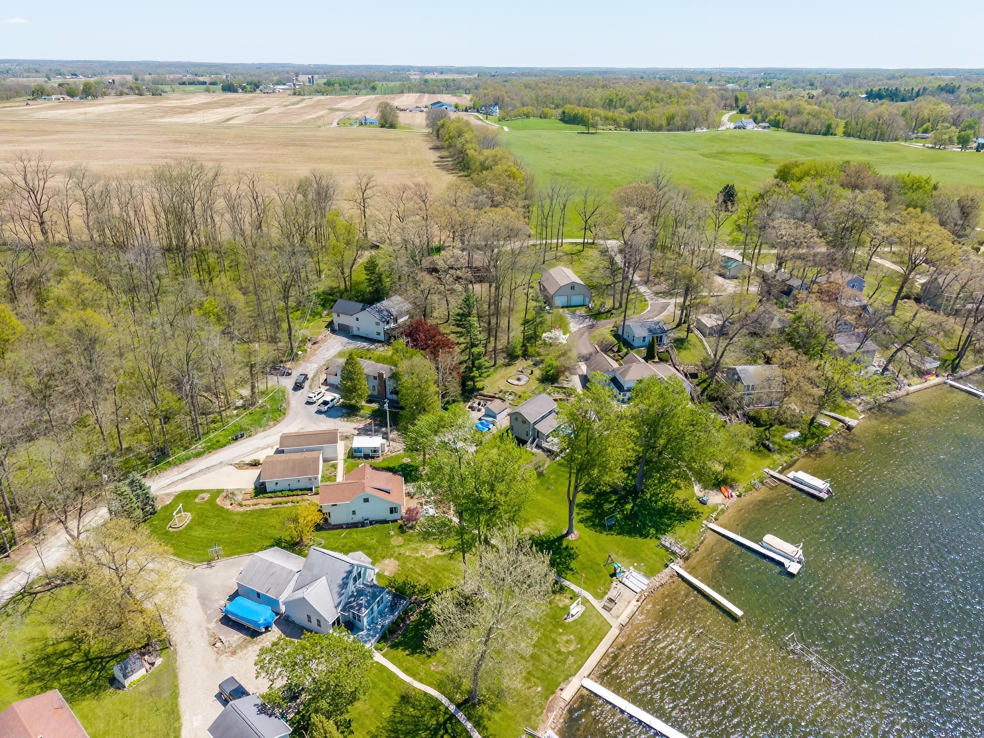 Waterfront property featuring multiple private docks extending into the lake