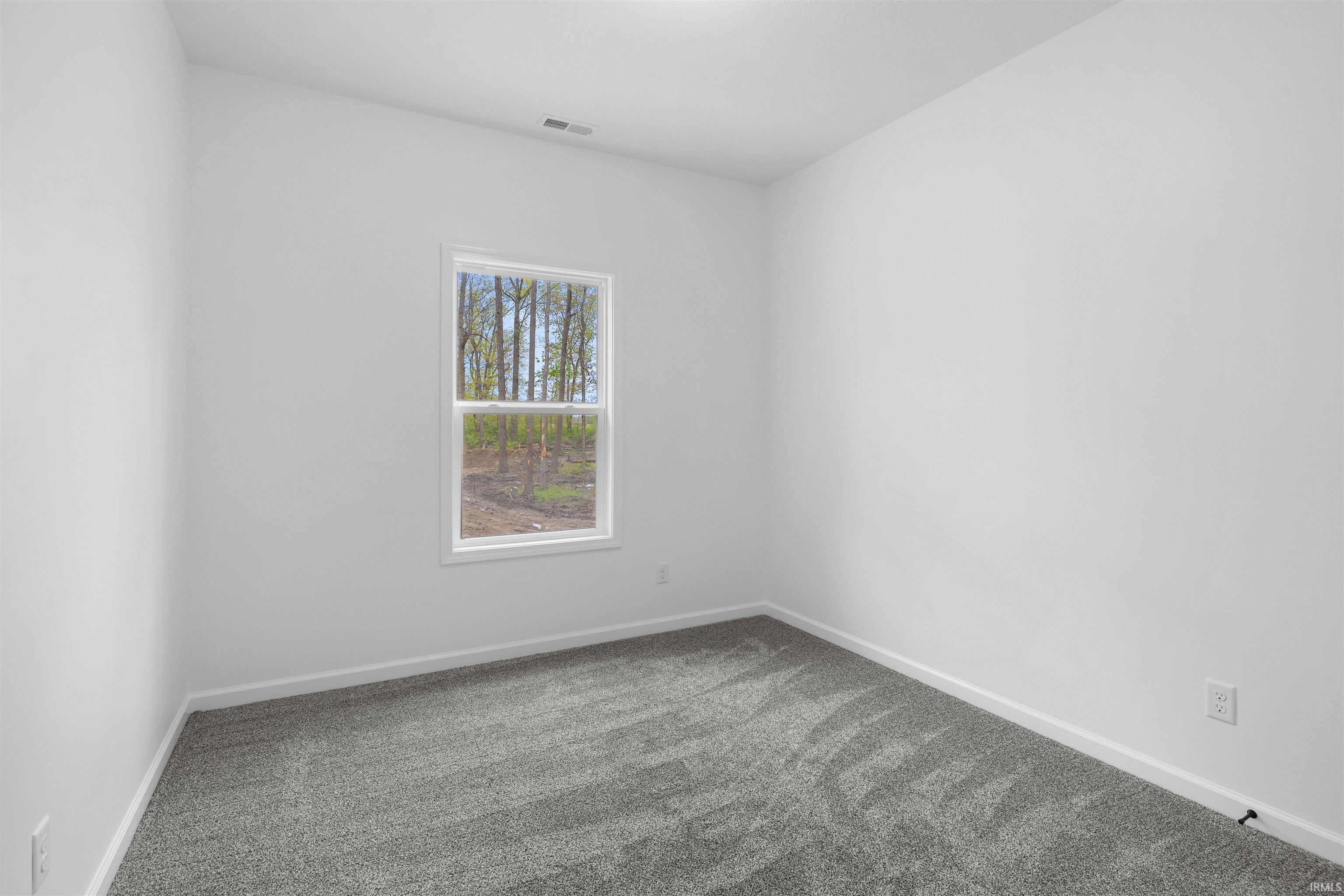 Neutral color palette with light walls and gray patterned carpeting