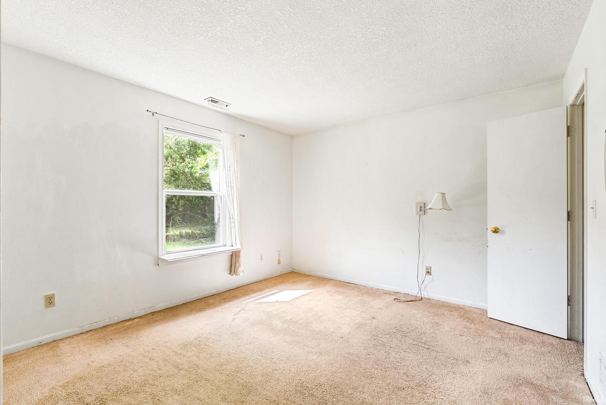 White walls with textured ceilings