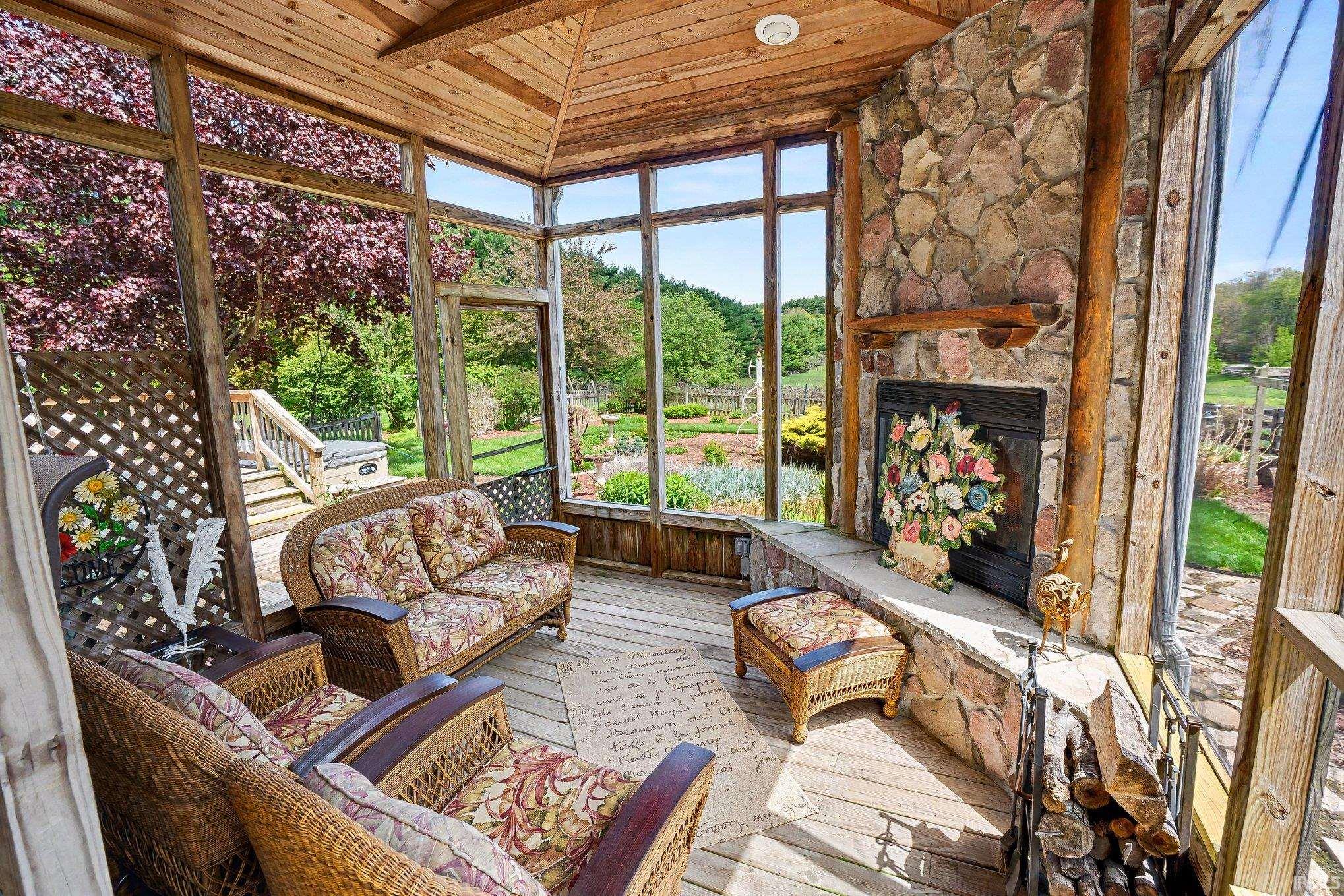 Enclosed porch with a wood-finish vaulted ceiling and flooring