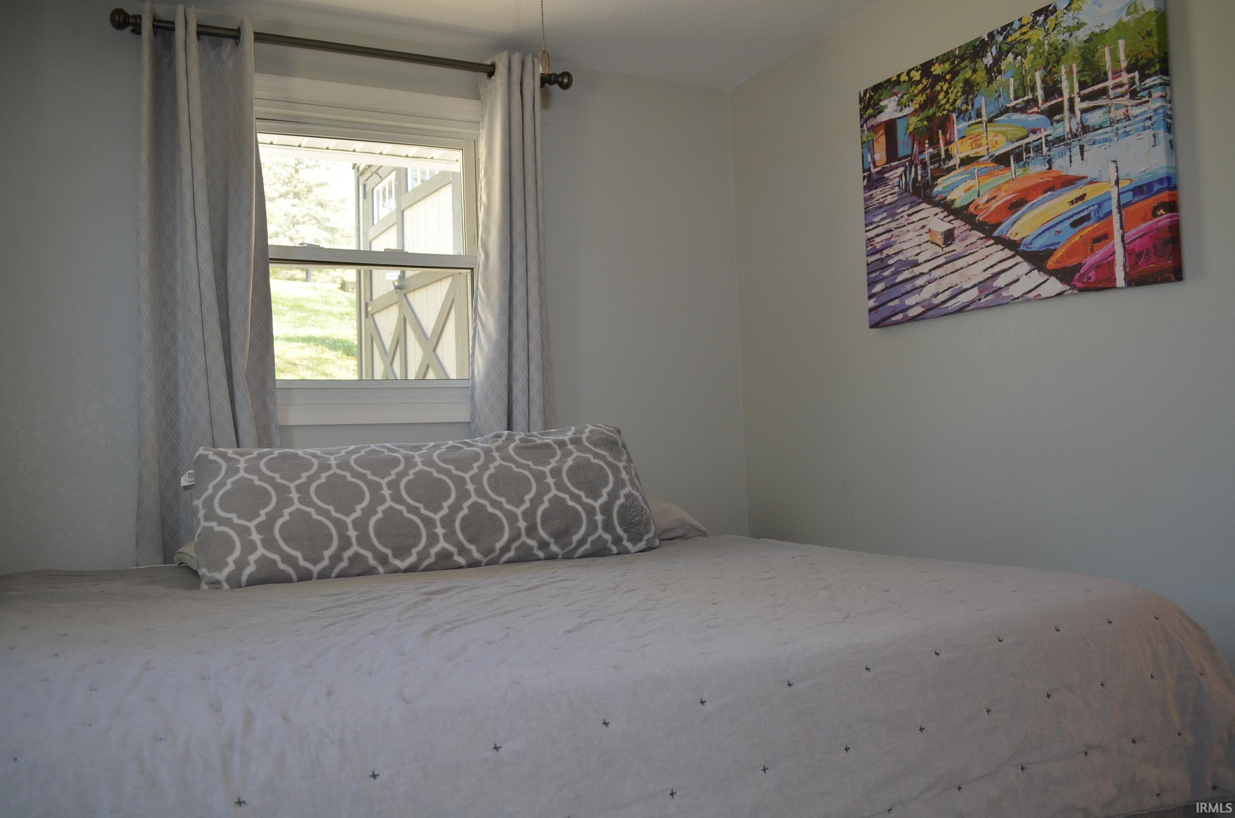 Double-hung window featuring a white frame and light gray walls