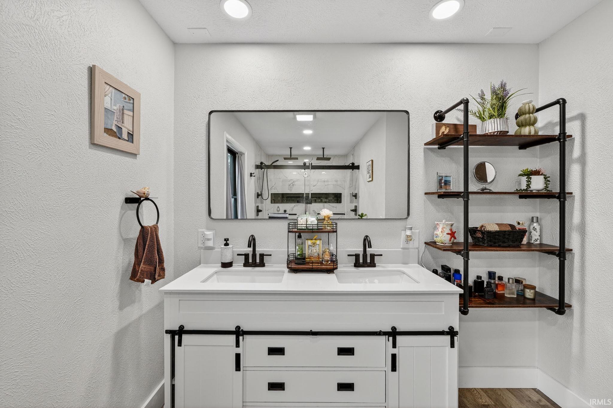 Dual sink vanity with white countertop and black hardware