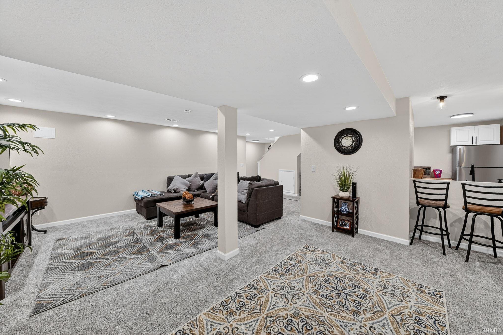 Finished lower level featuring recessed lighting, light-colored walls, and carpeting