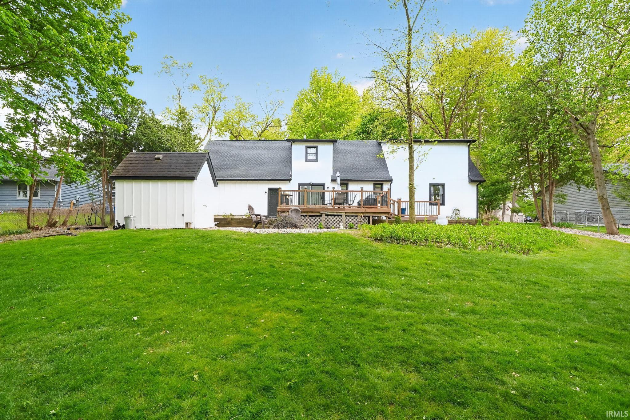 Spacious backyard featuring a generous lawn area