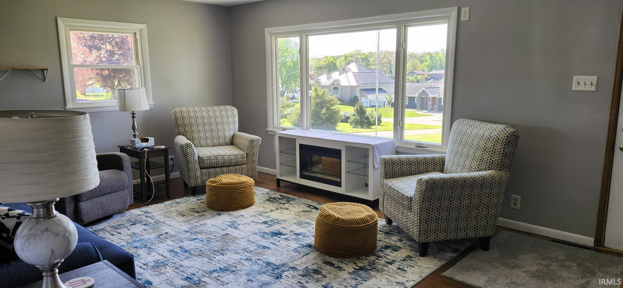 Expansive bay window featuring white trim and a built-in media console