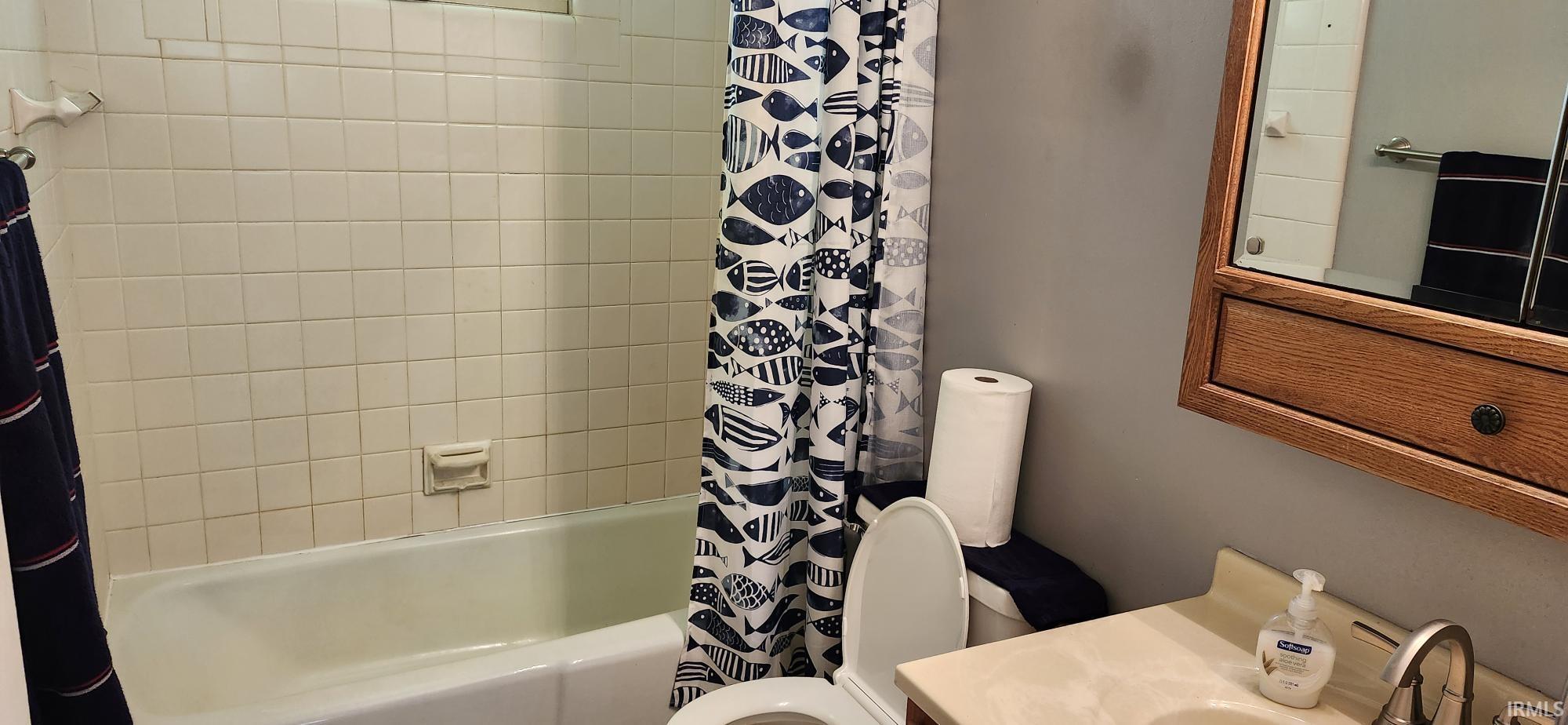 White tiled shower surround with a built-in tub