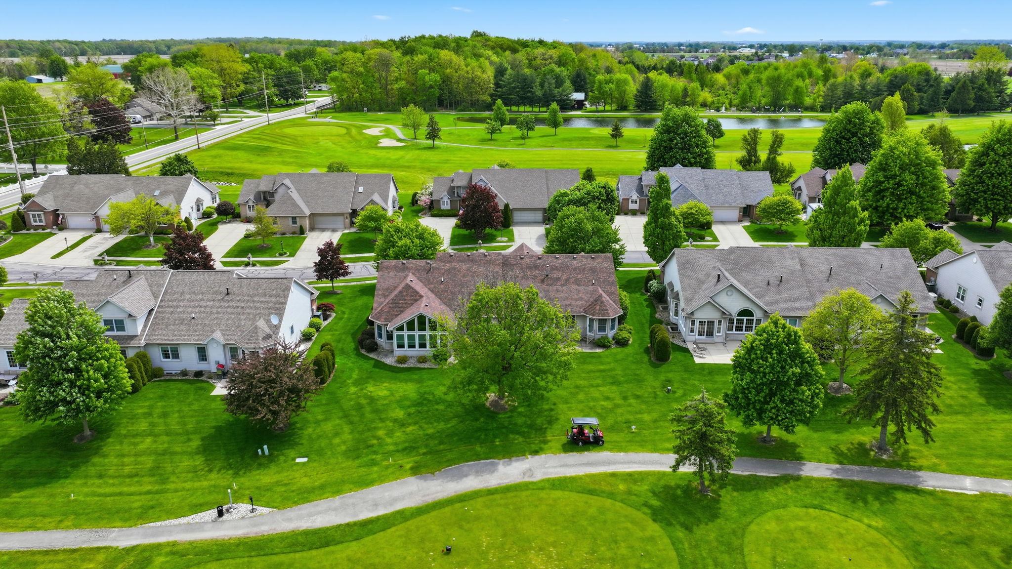 Aerial perspective showcasing a residential community with mature landscaping