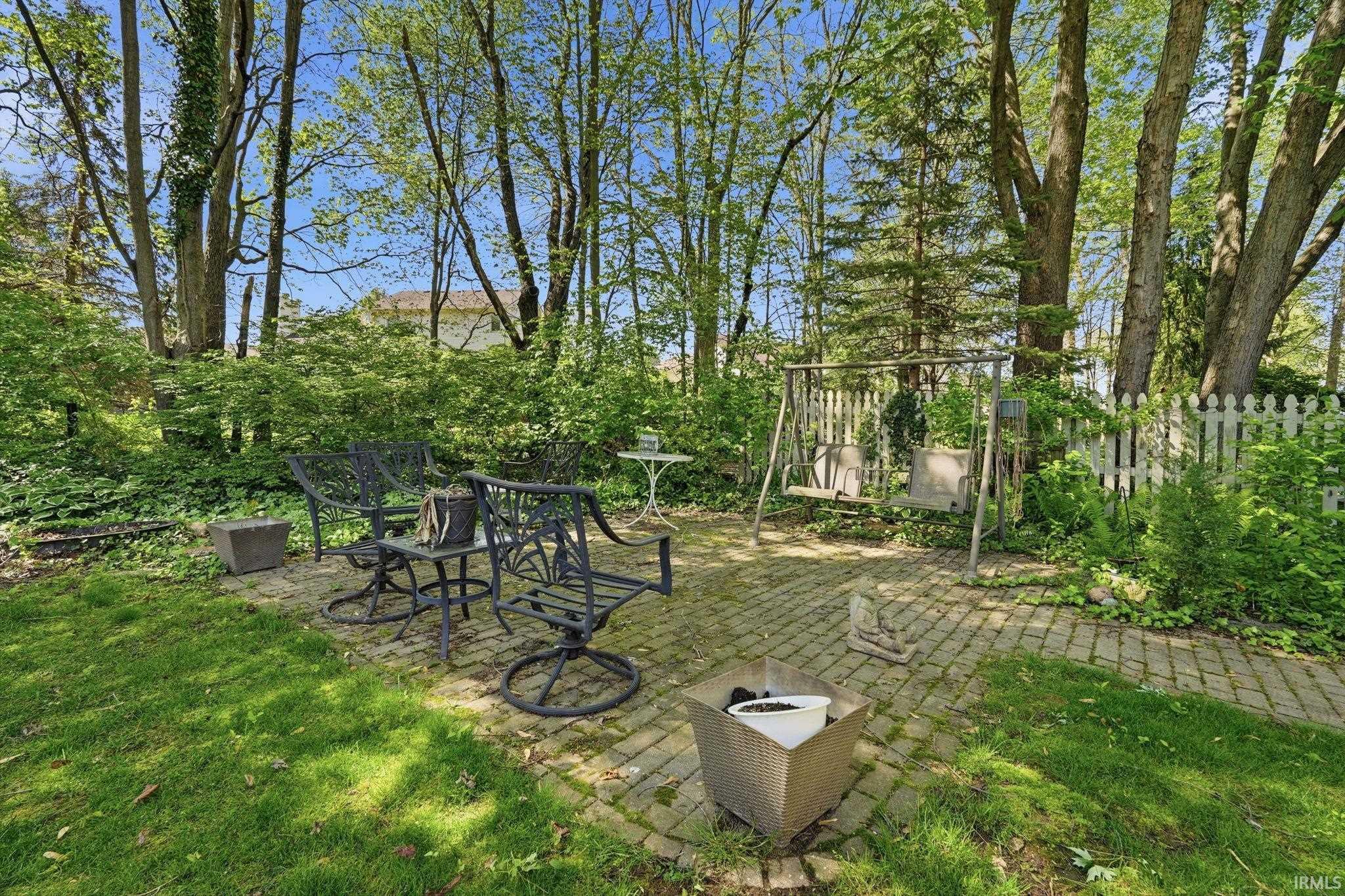 Expansive outdoor patio featuring brick paver construction