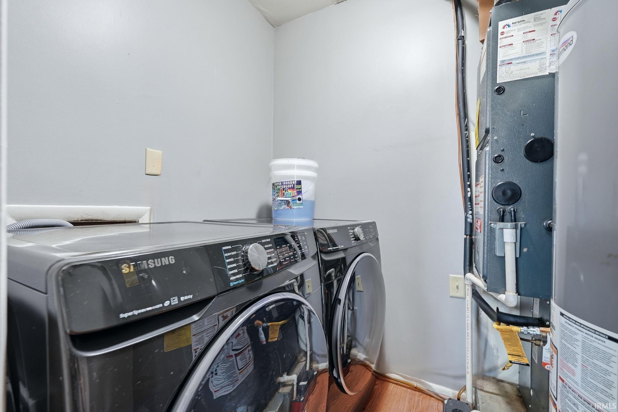 Utility area featuring a water heater and furnace, providing essential systems for the property