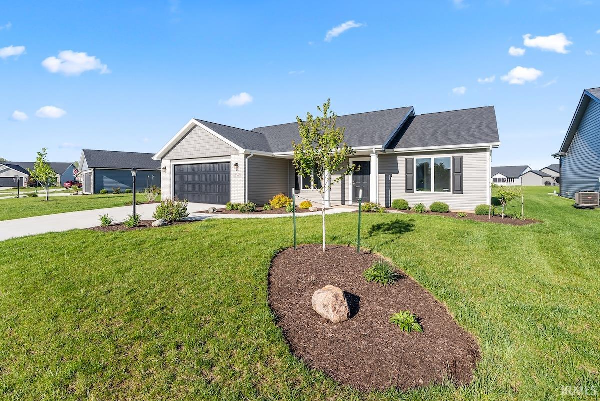 Ranch-style exterior featuring light gray siding and dark gray architectural shingles