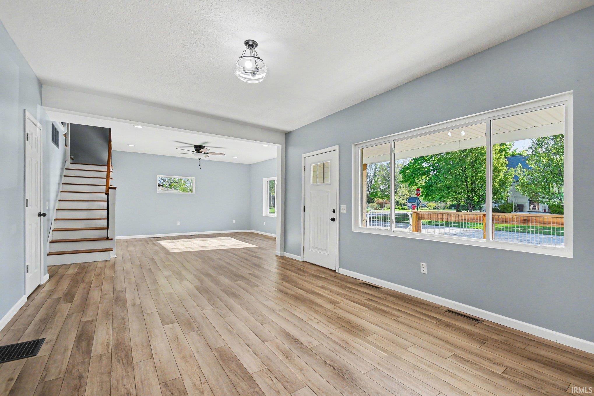 Open-concept living space with Luxury Vinyl Flooring & Freshly Painted 2026