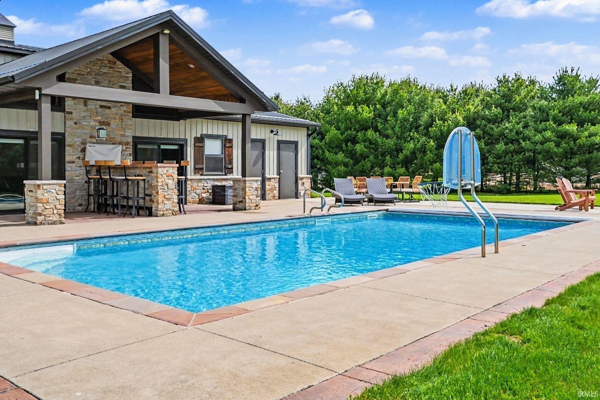 In-ground pool with perfect area to entertain all your guests