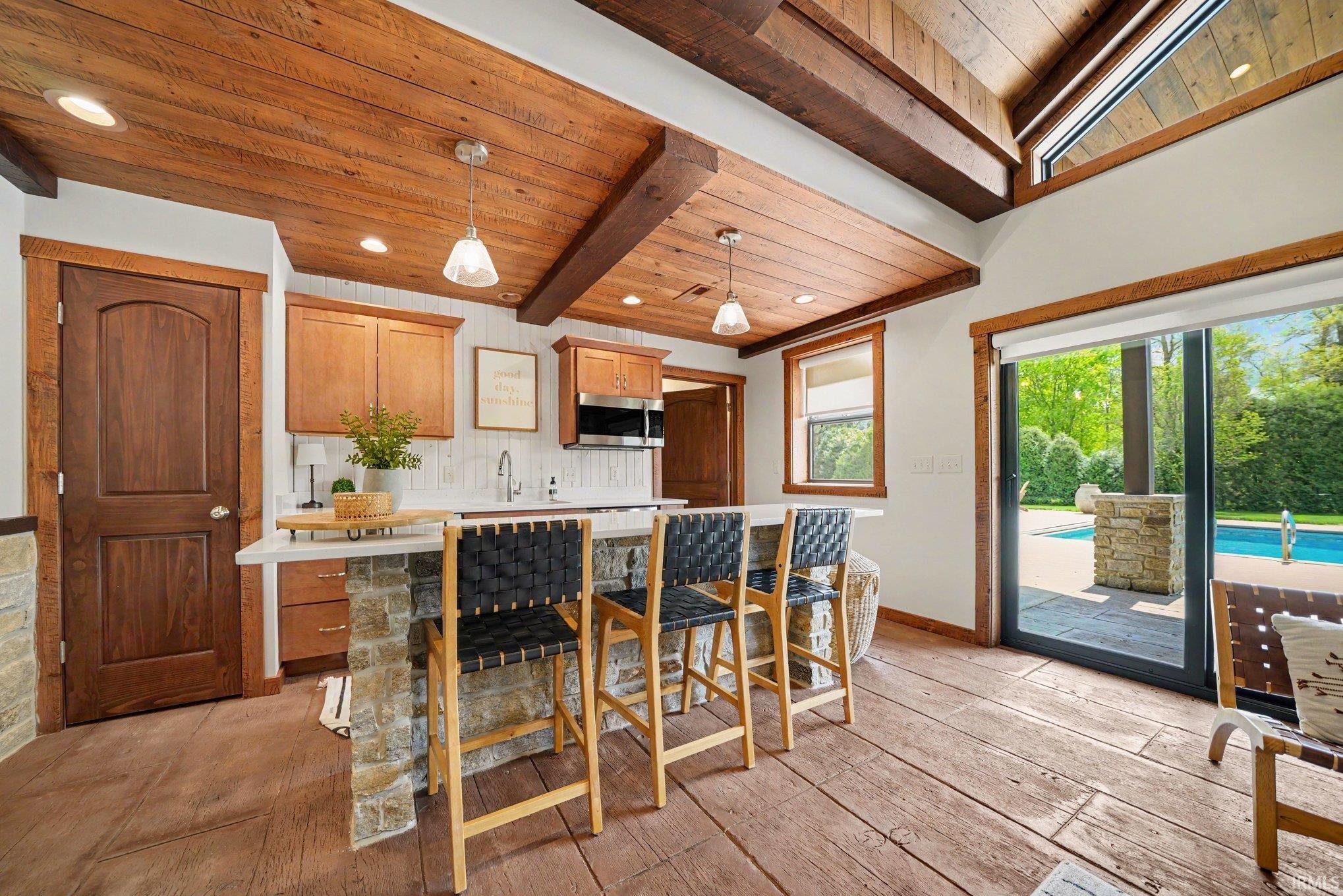 Poolhouse Kitchen with pool views and room to entertain