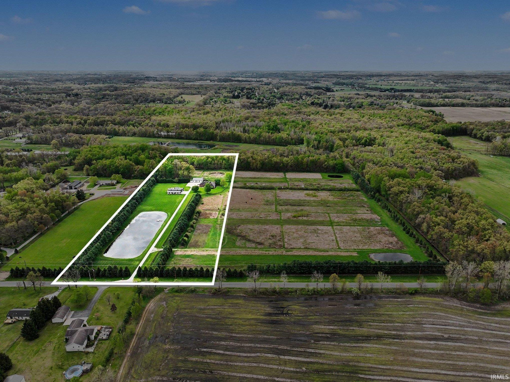 Tract 1 - Tree Lined 12.75 (+/-) acres with house, shop, poolhouse, barn, pool, pond, and fenced pasture
