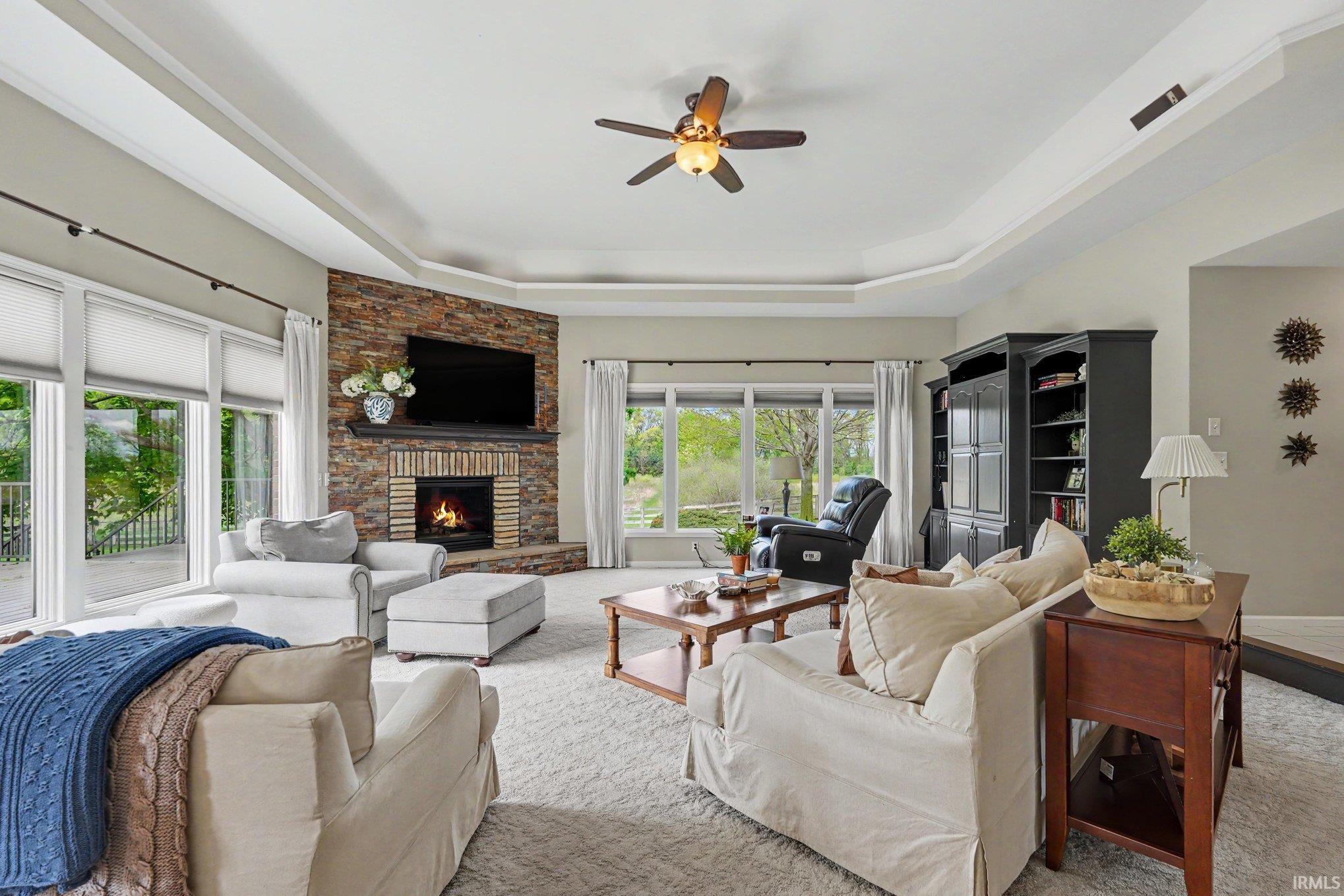 Enjoy the natural light and the fireplace in this great space