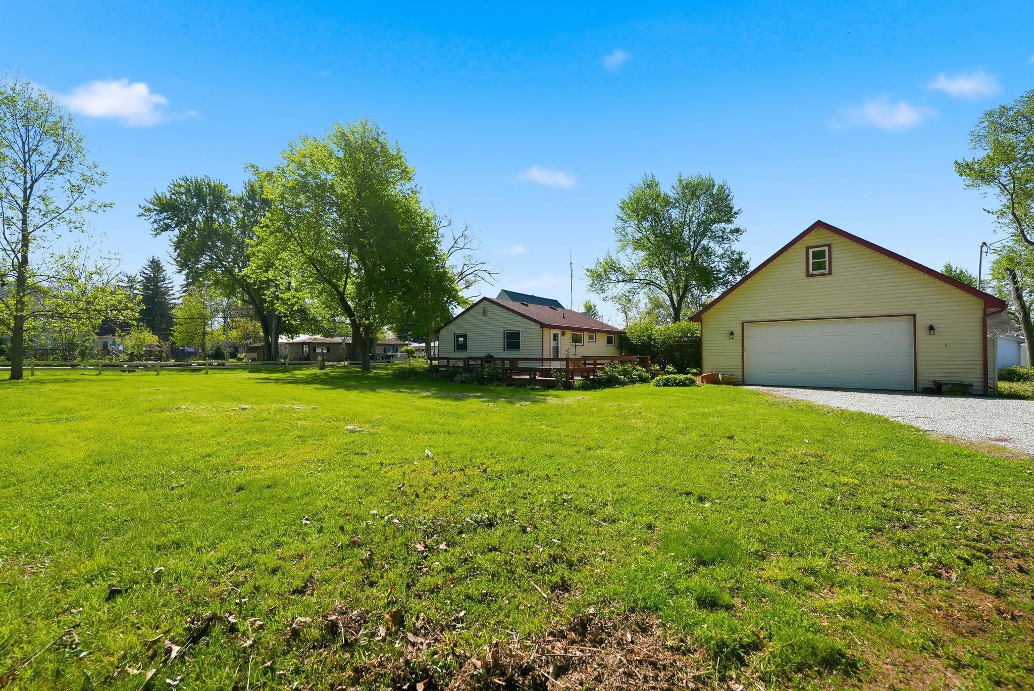 Expansive green lawn with mature trees