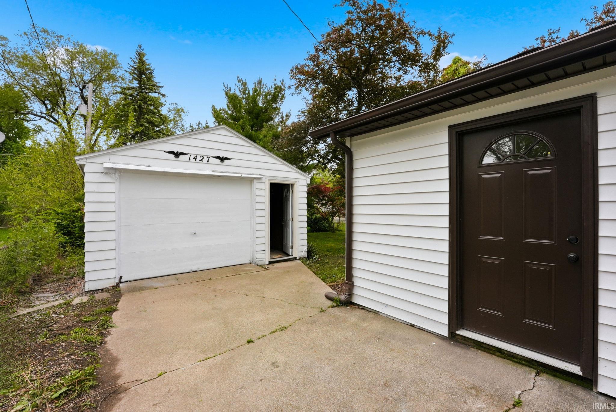 Detached single-car garage and additional exterior access door