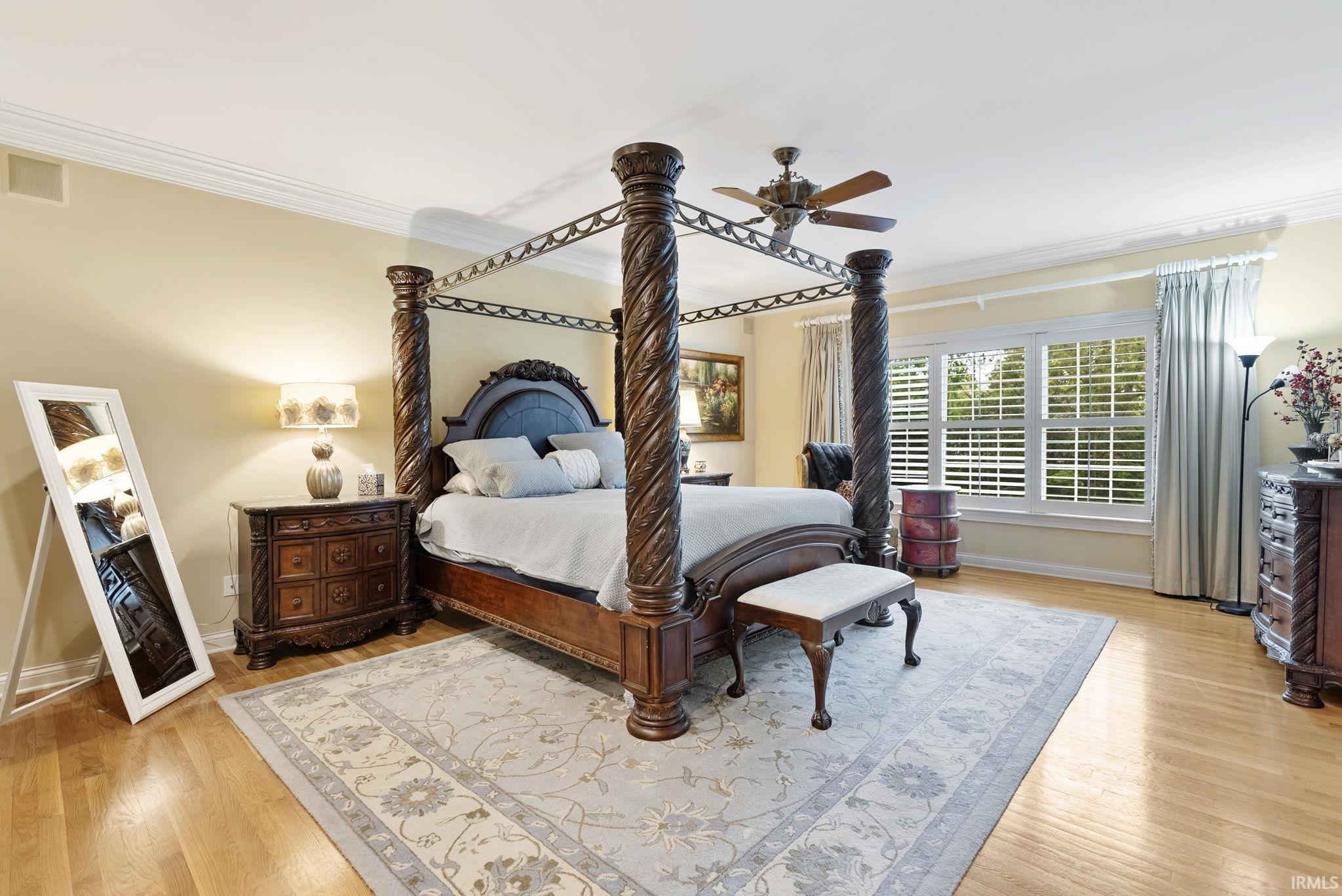 Hardwood flooring throughout the room, complemented by a large area rug