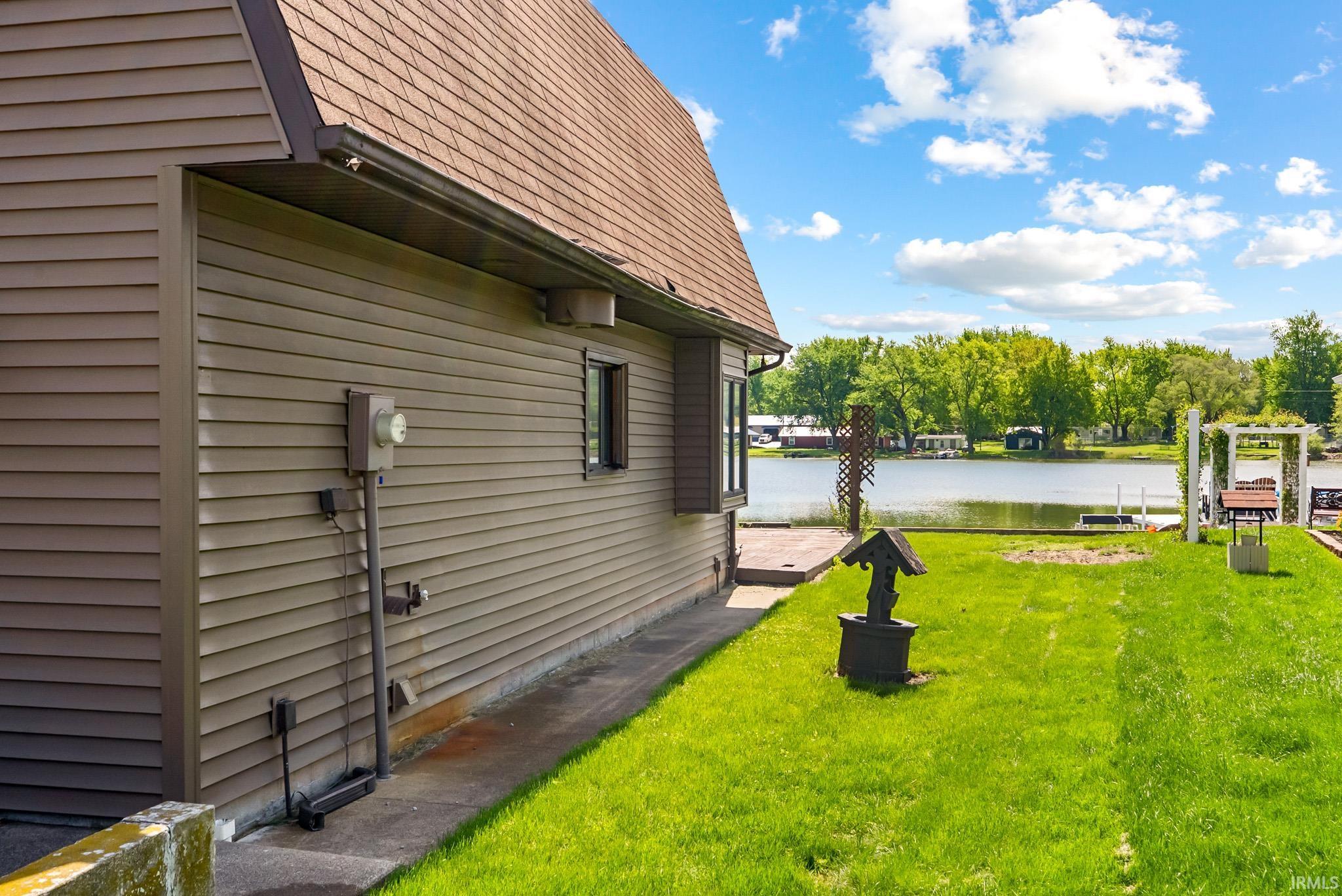 Expansive waterfront lawn with direct access to the water