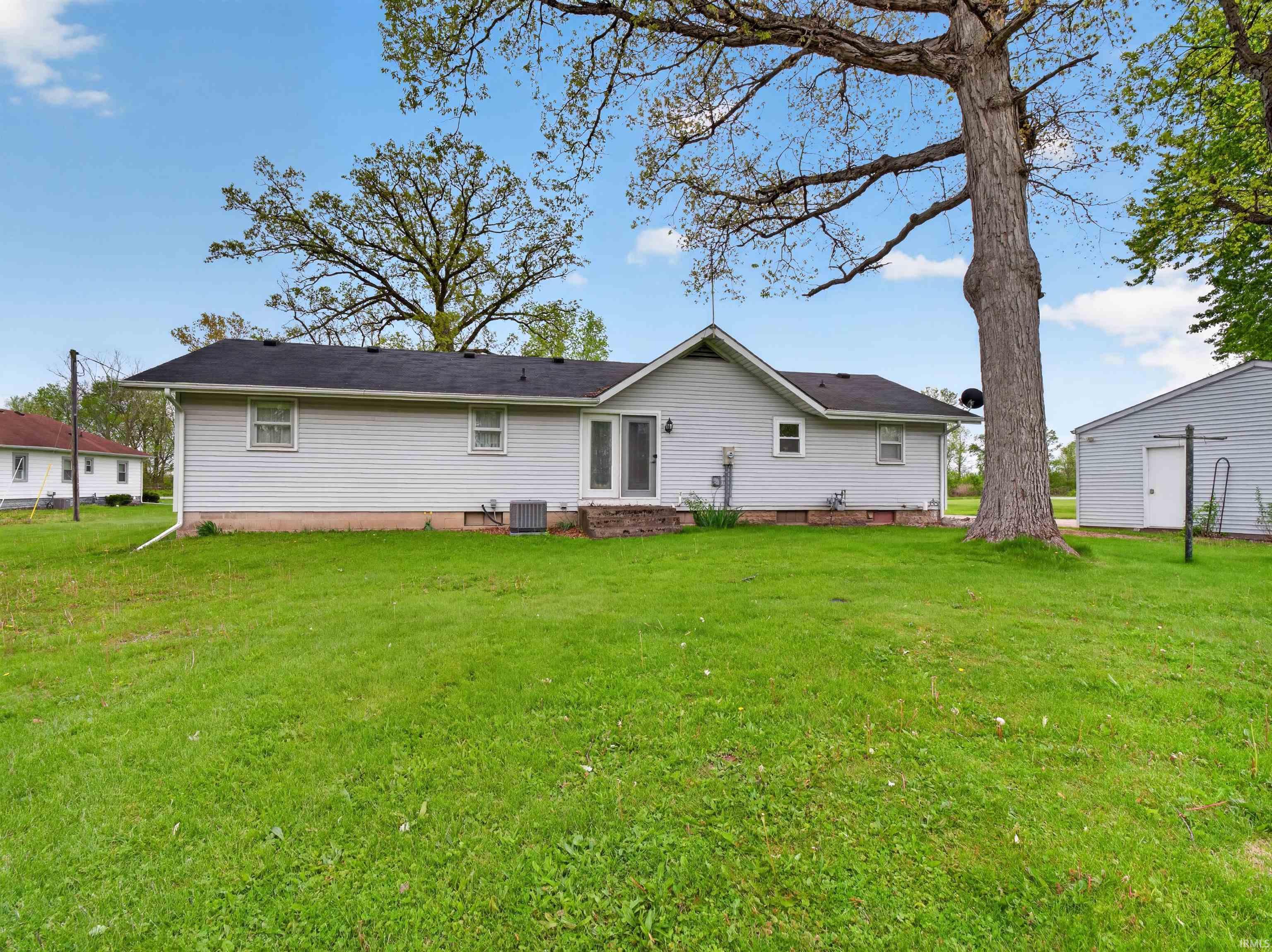 Expansive green lawn providing abundant outdoor space