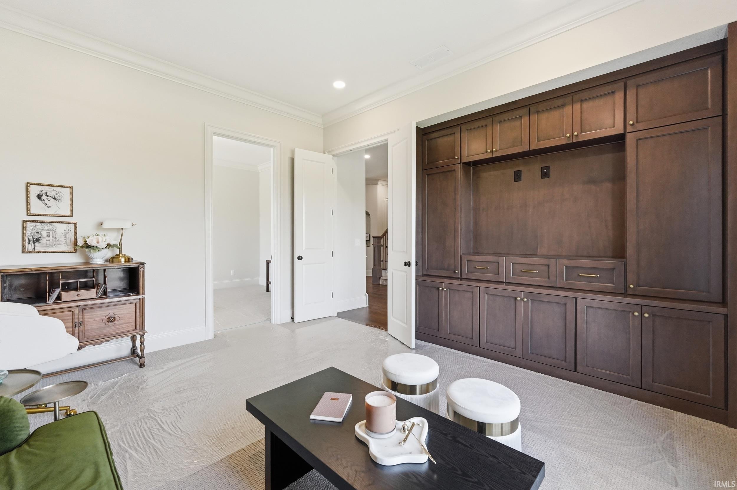 Integrated dark wood built-in media center with ample storage and display space