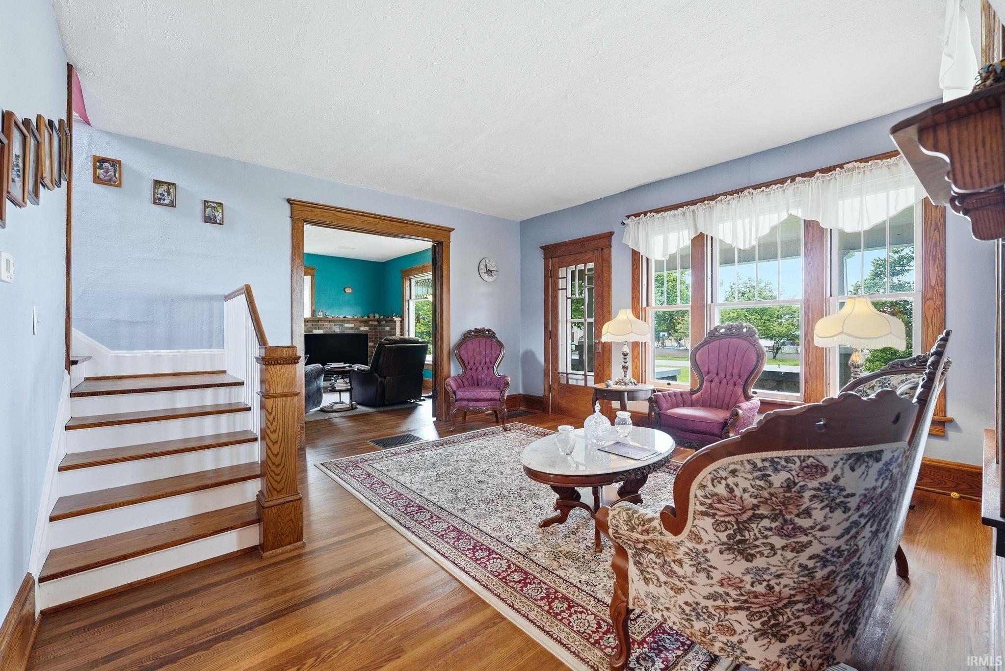 Hardwood flooring extending throughout the space