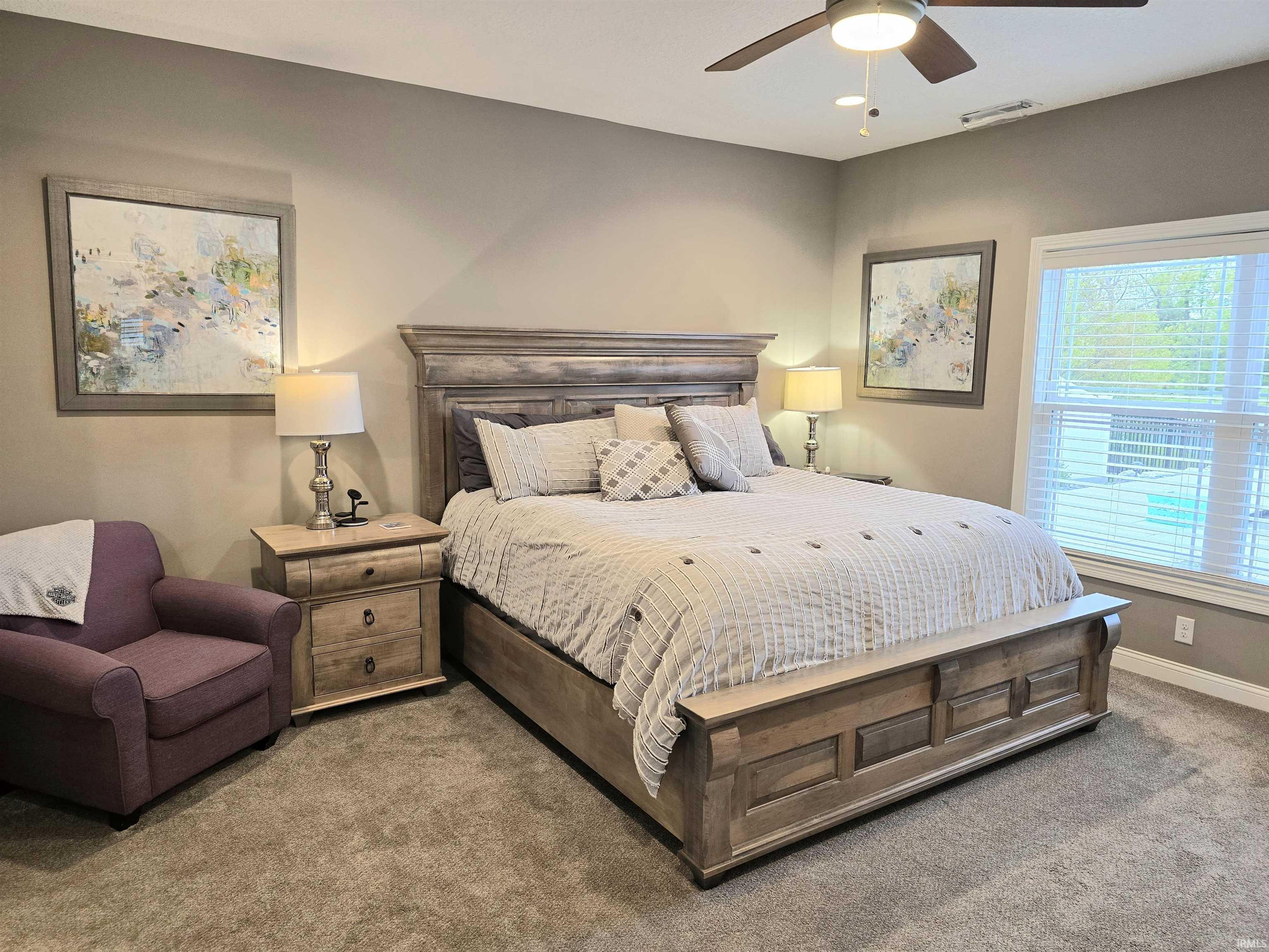 Beautiful views of the pool & pond from this large bedroom.