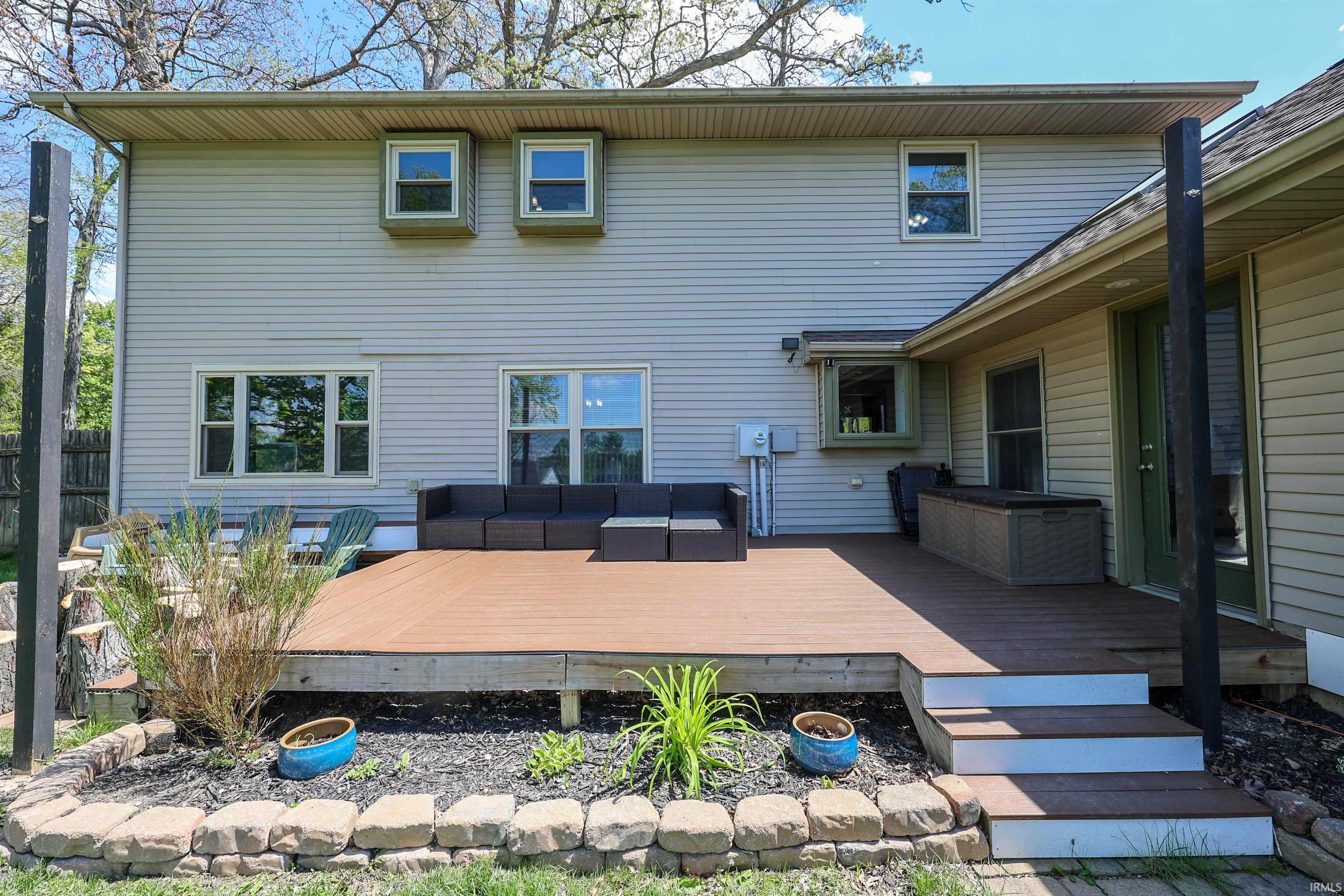 Spacious outdoor deck featuring composite decking and steps