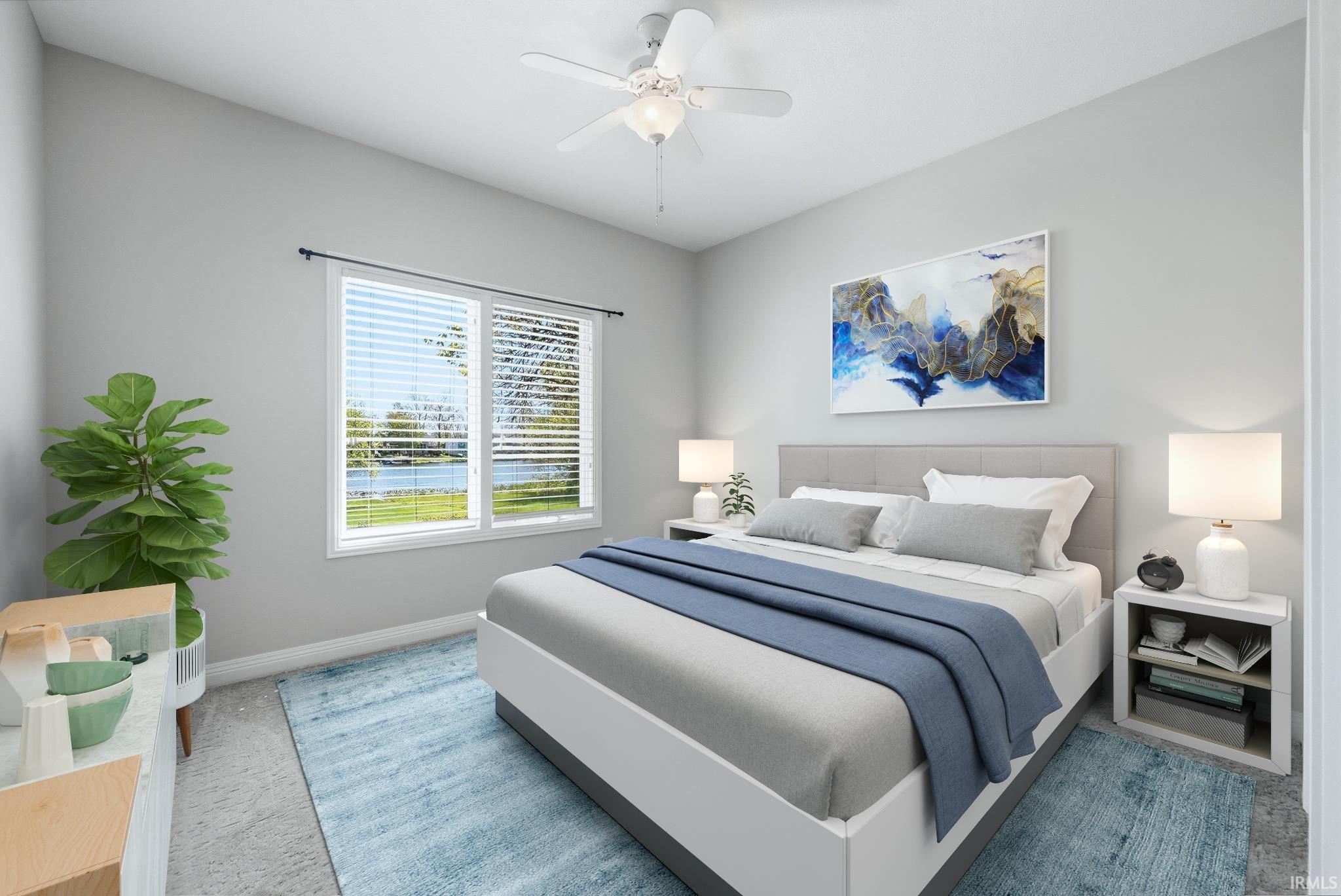 Bright bedroom featuring a large window with horizontal blinds, a ceiling fan with integrated lighting, and light gray wall paint