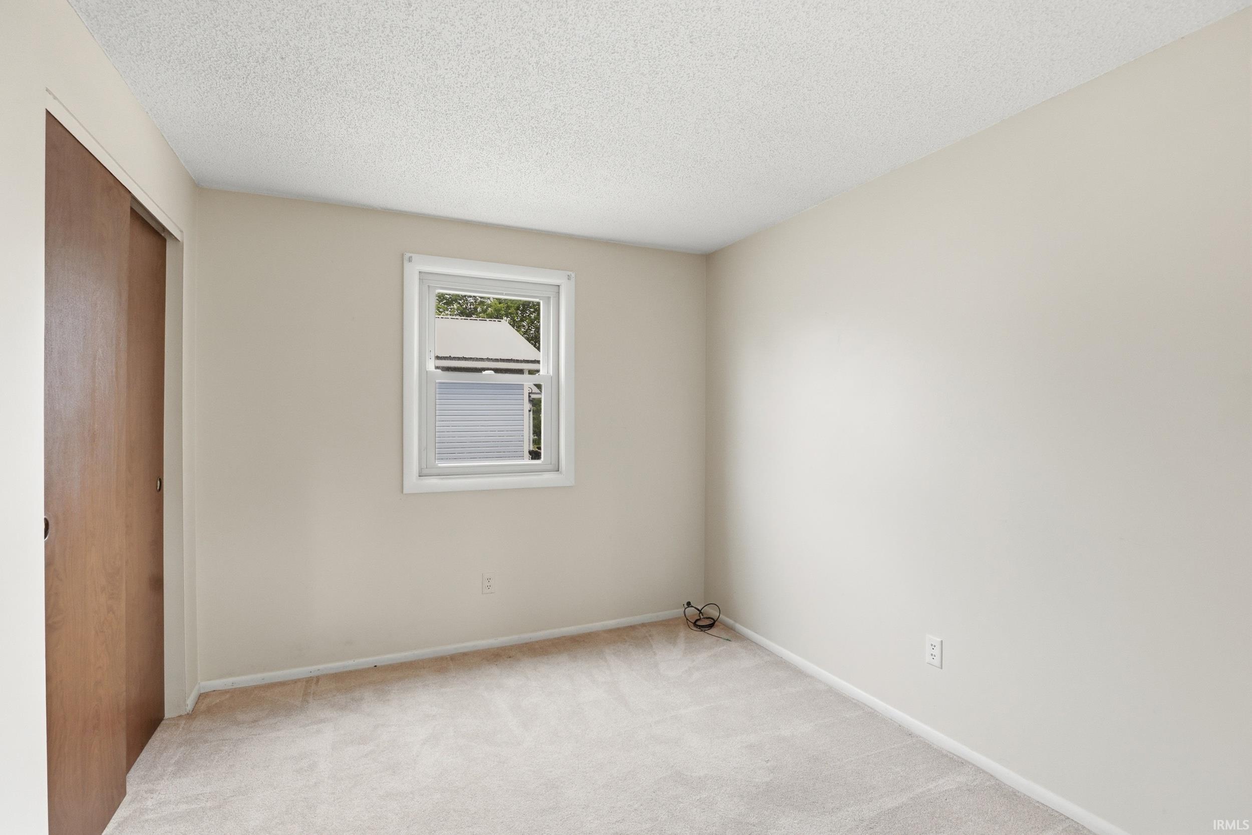 Wall-to-wall carpeting and neutral wall tones