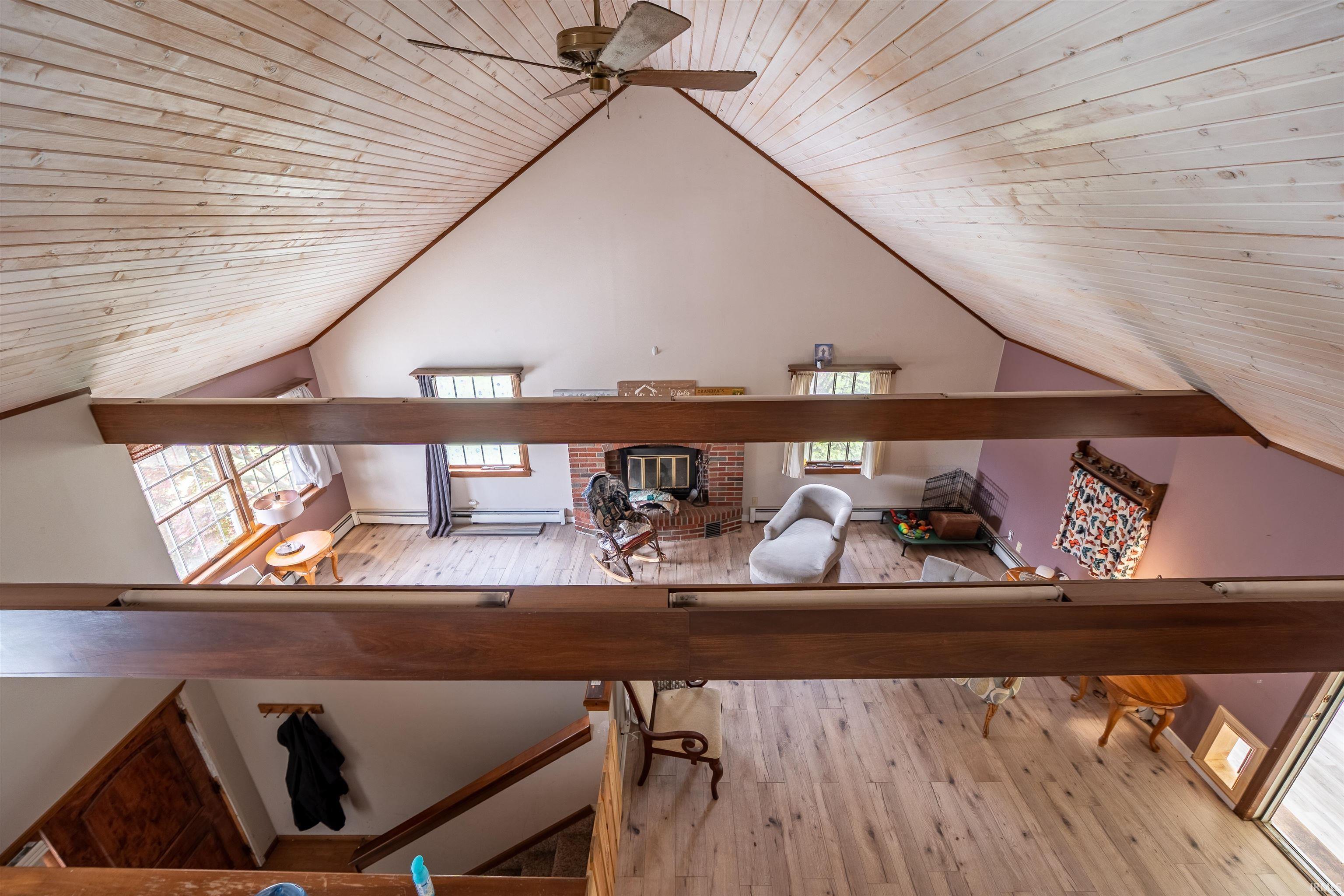 Vaulted wood-paneled ceiling with exposed beams