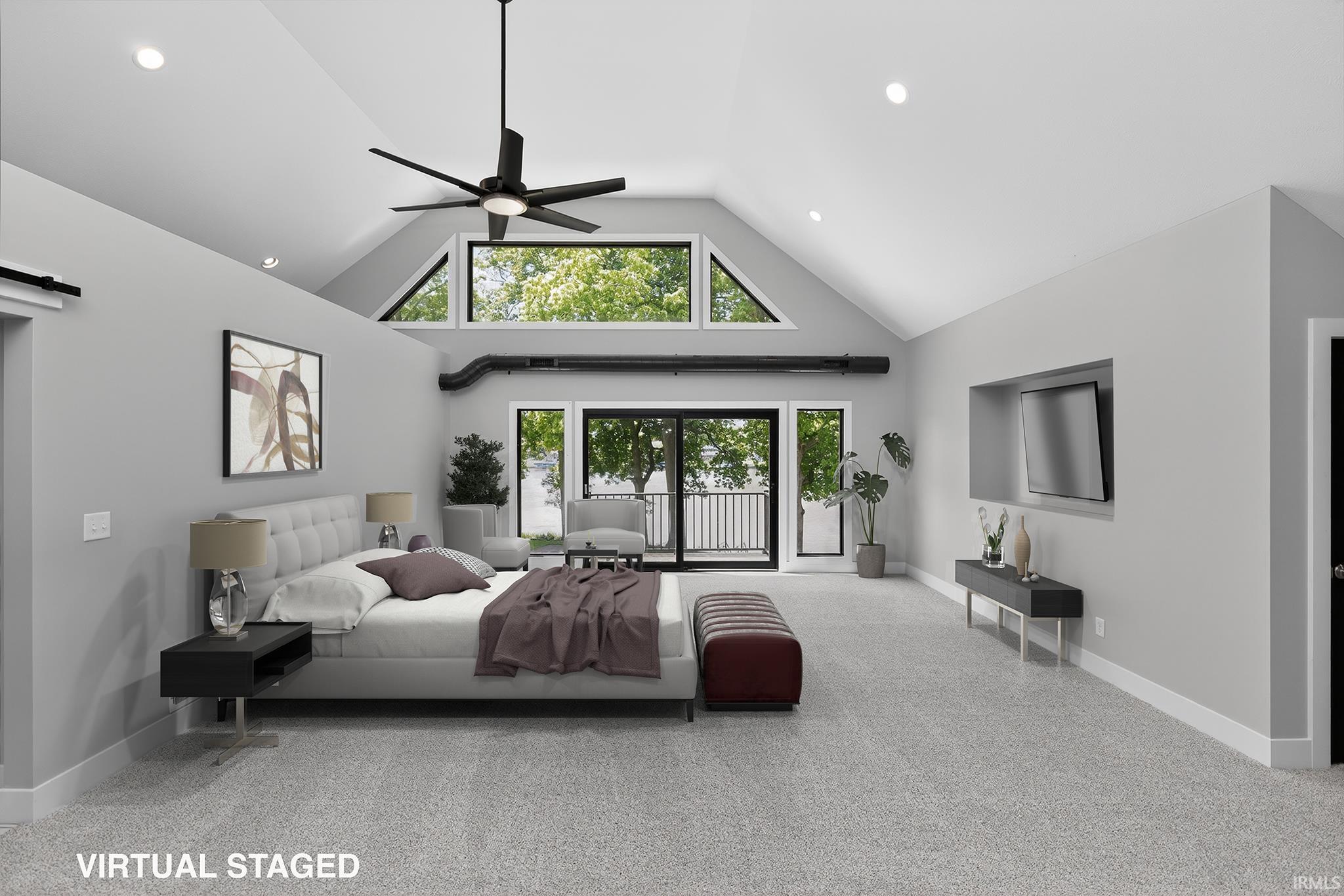 Expansive room with vaulted ceilings and recessed lighting