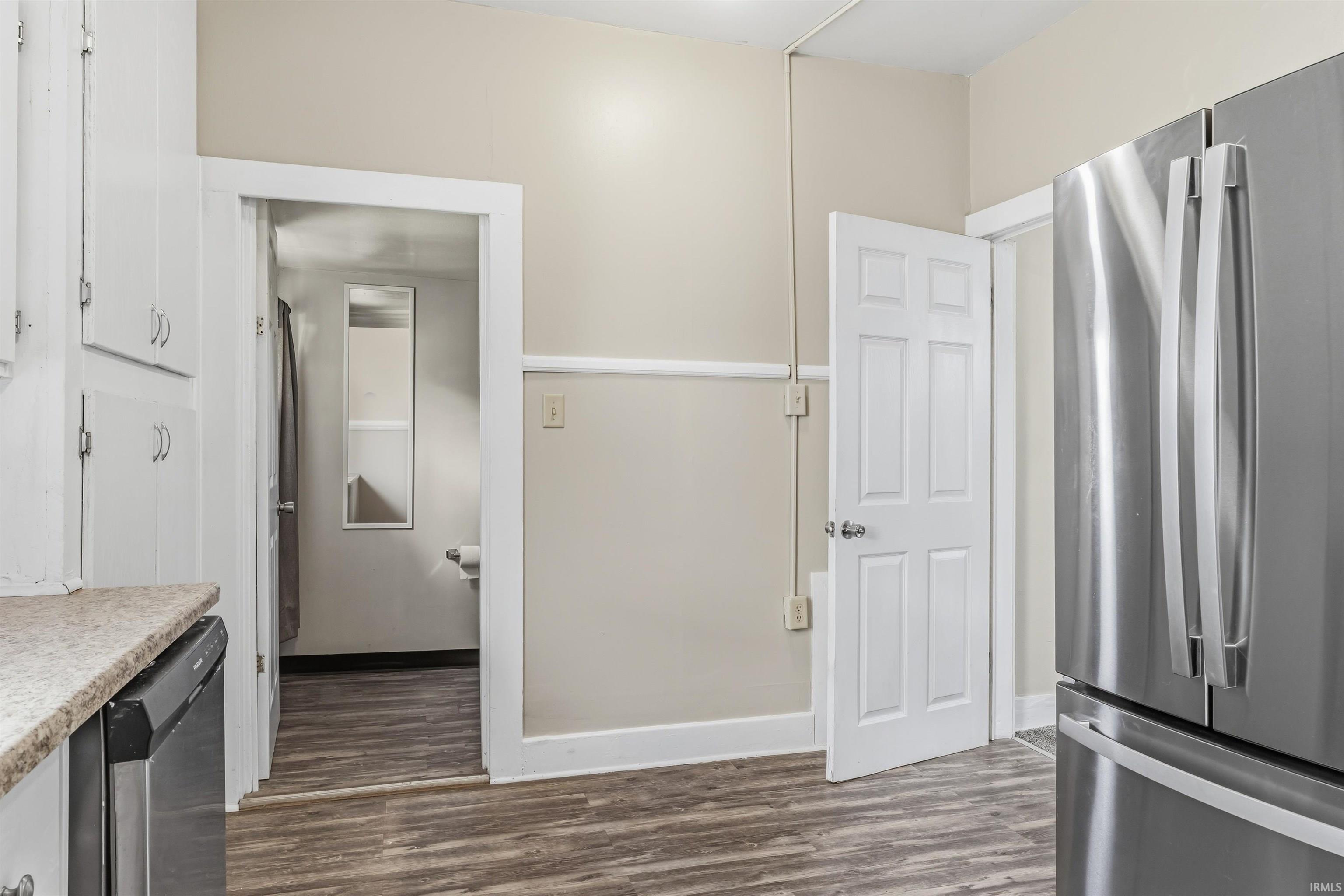 Stainless steel refrigerator with double doors and bottom freezer drawer